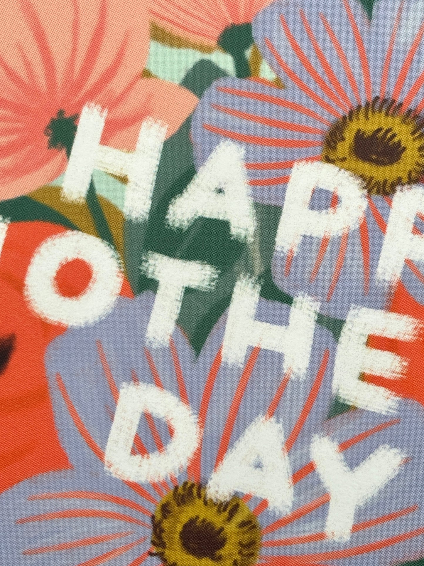 closeup shot of Mother's Day card text and vibrant floral pattern brush stroke texture, modern botanical illustration detail