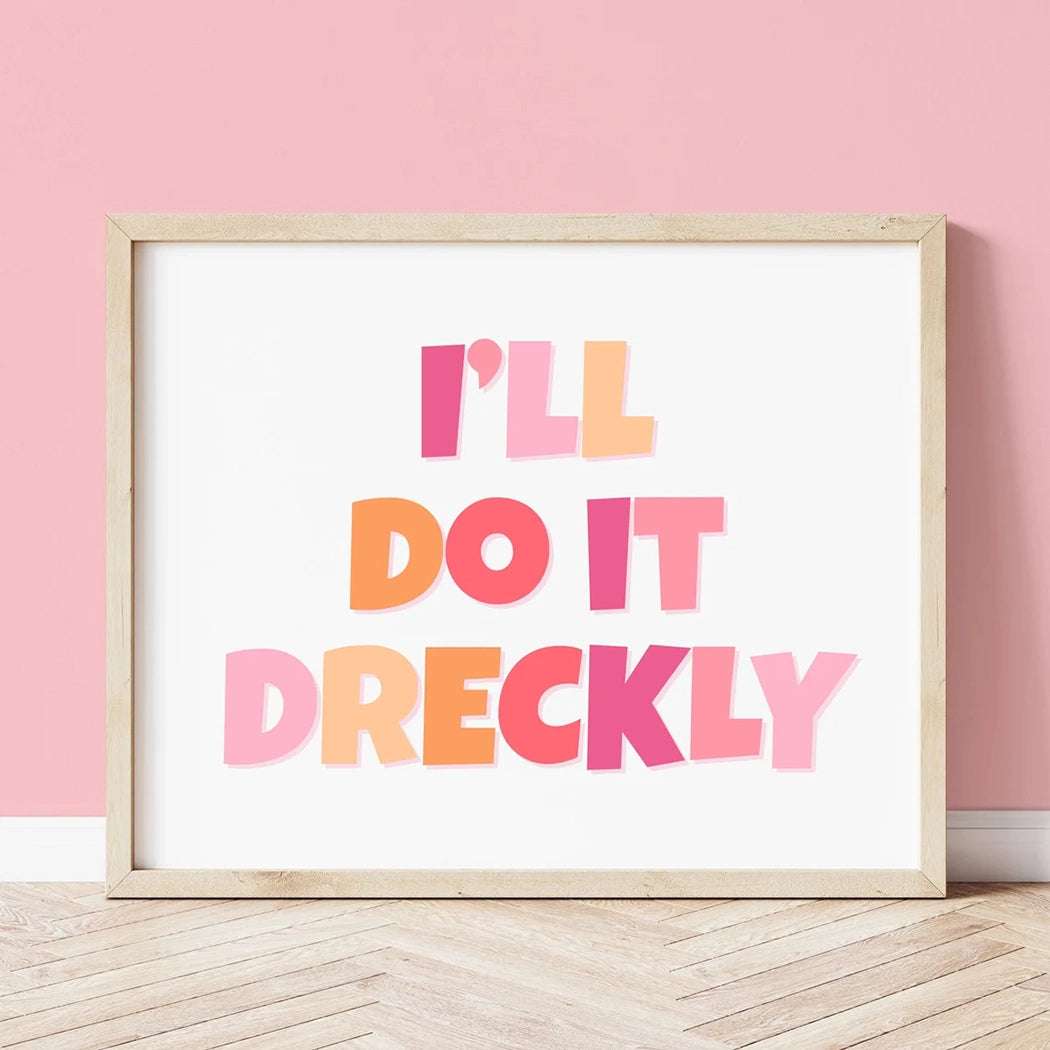 Lifestyle view of 'I'll Do It Dreckly' print pink and orange retro typography fun Cornish slang home decor.