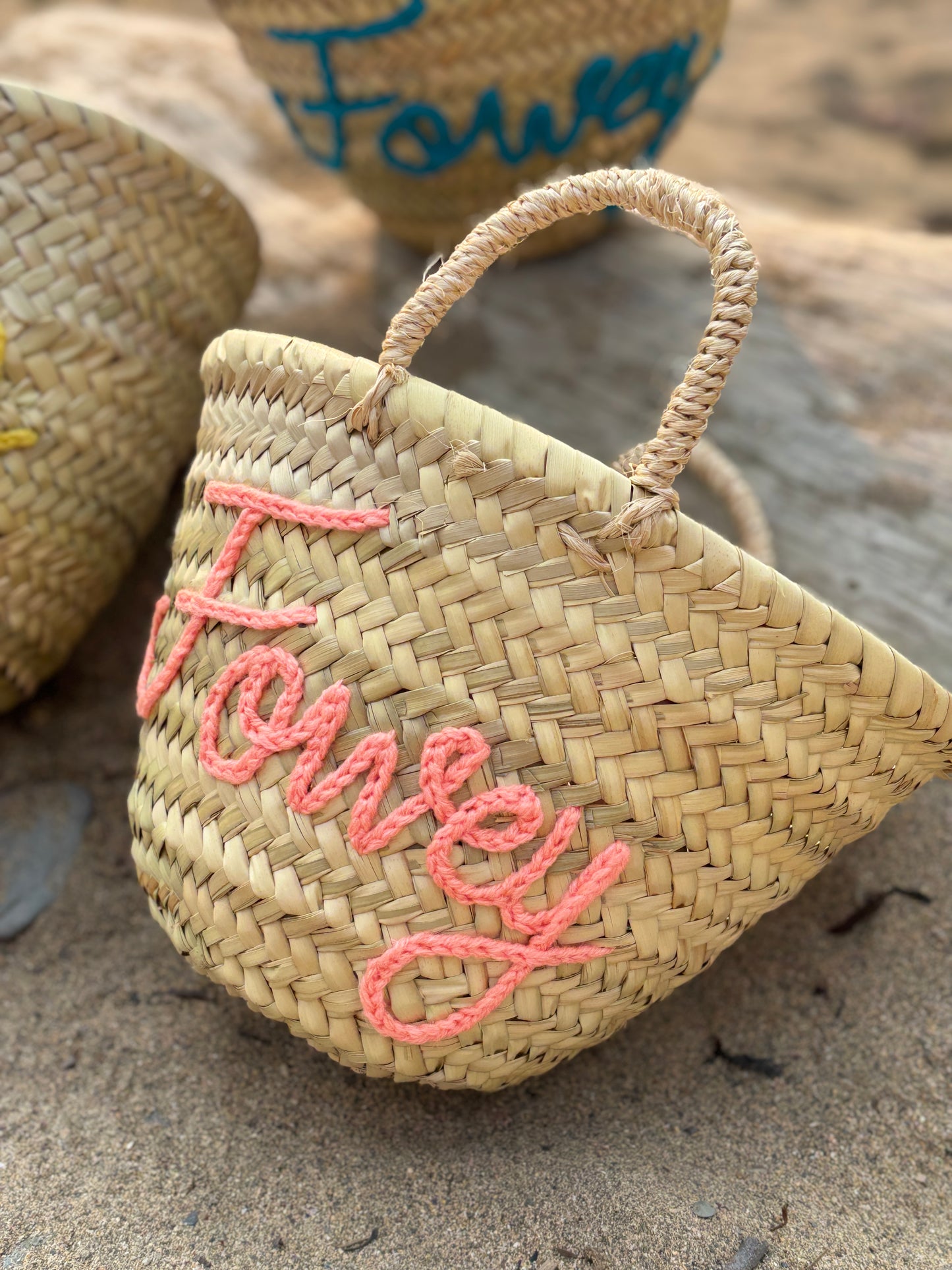 woven straw mini beach basket with "Fowey" embroidered in salmon pink yarn summer tote bag, personalized straw bag