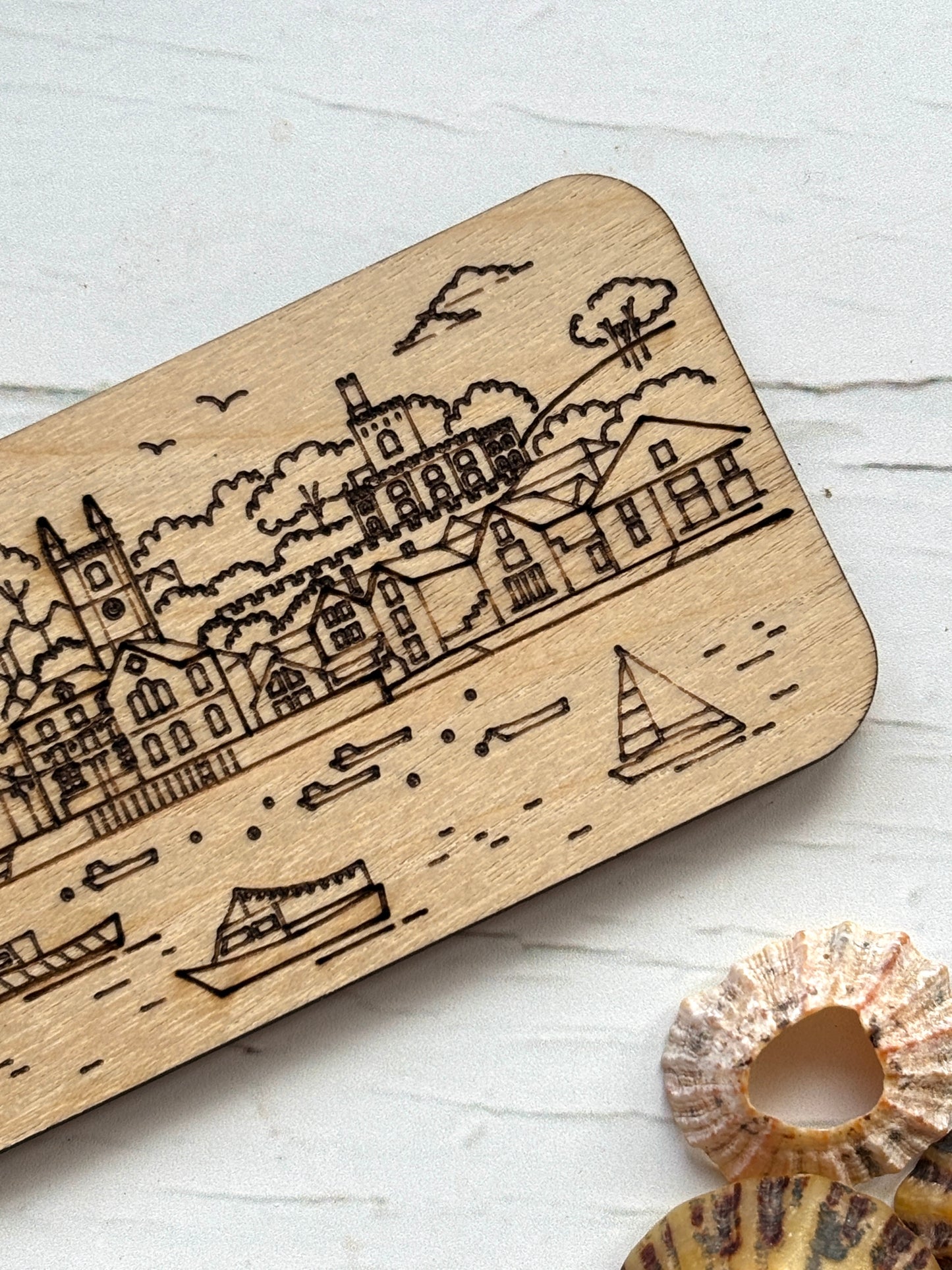 Fowey wooden refrigerator magnet detail, sailboat harbor engraving, Cornwall coastal town artwork, wood grain texture
