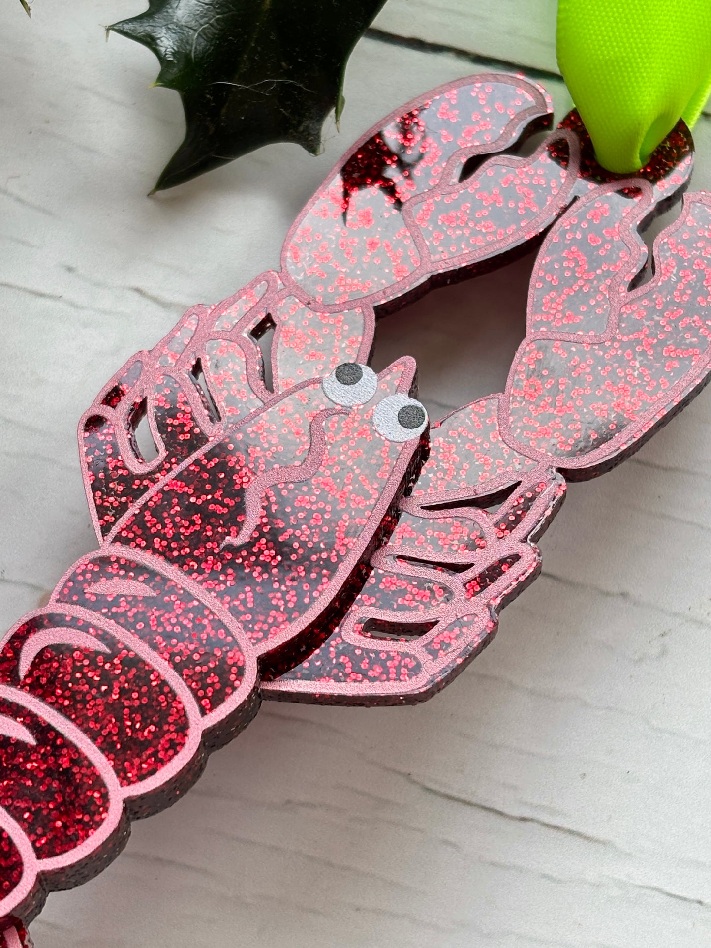 glittery lobster Christmas decor—red sparkly ornament with green ribbon, perfect for quirky holiday tree styling and festive gifting