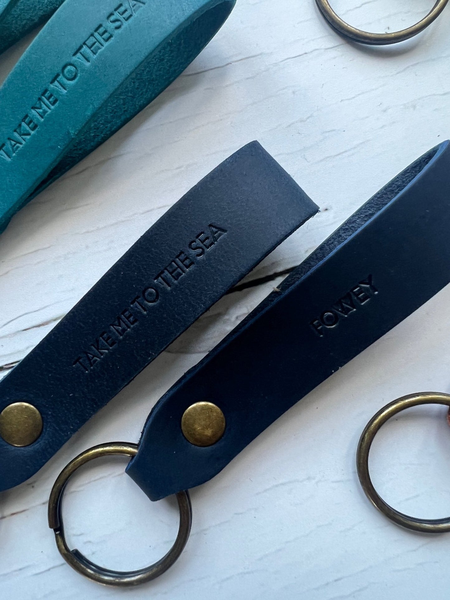 handmade navy leather keyring—embossed “Take Me to the Sea” with brass ring, coastal gift for ocean lovers