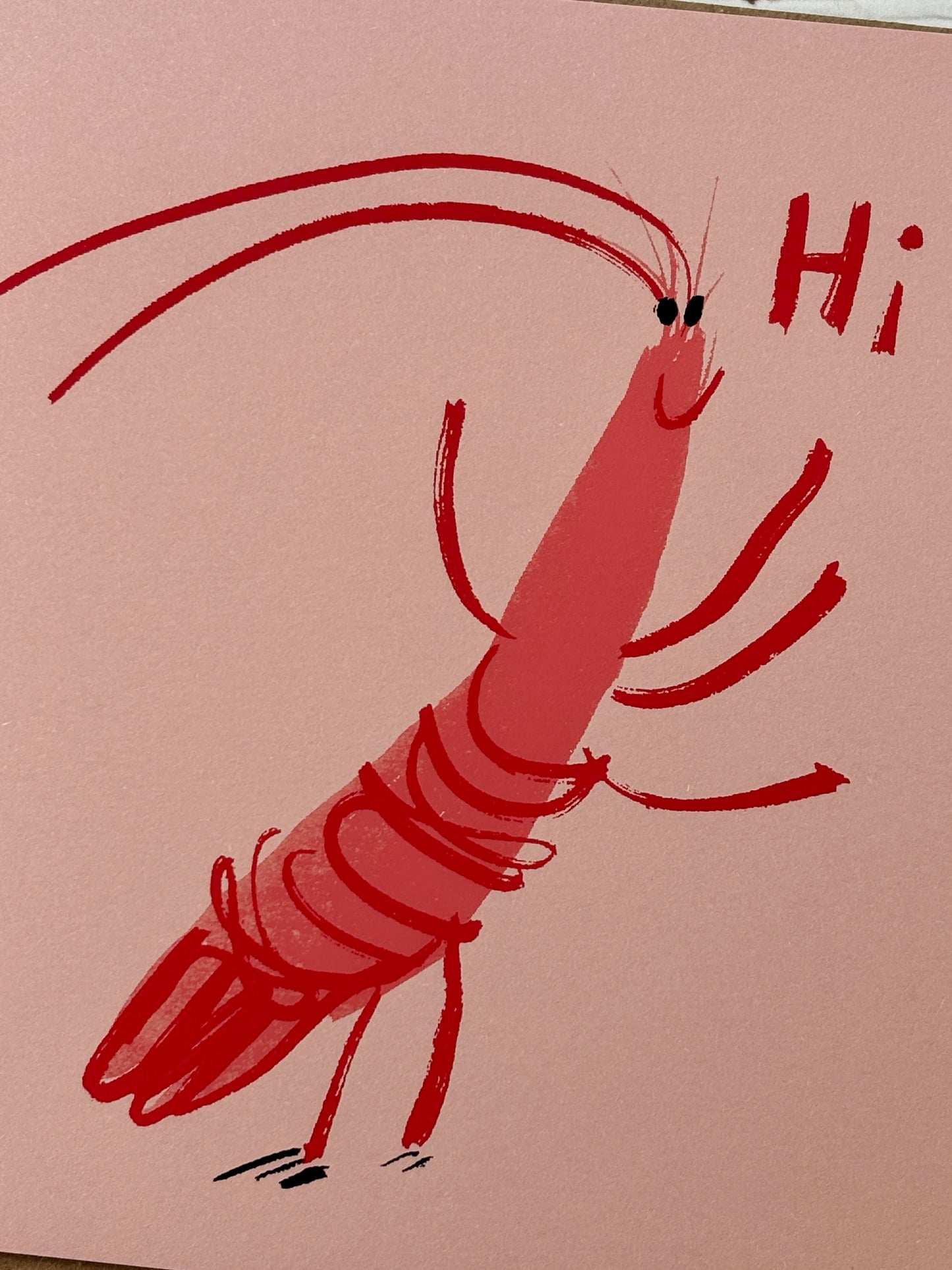 closeup shot of prawn greeting card—cartoon shrimp on pink, playful coastal stationery for casual, fun gifting