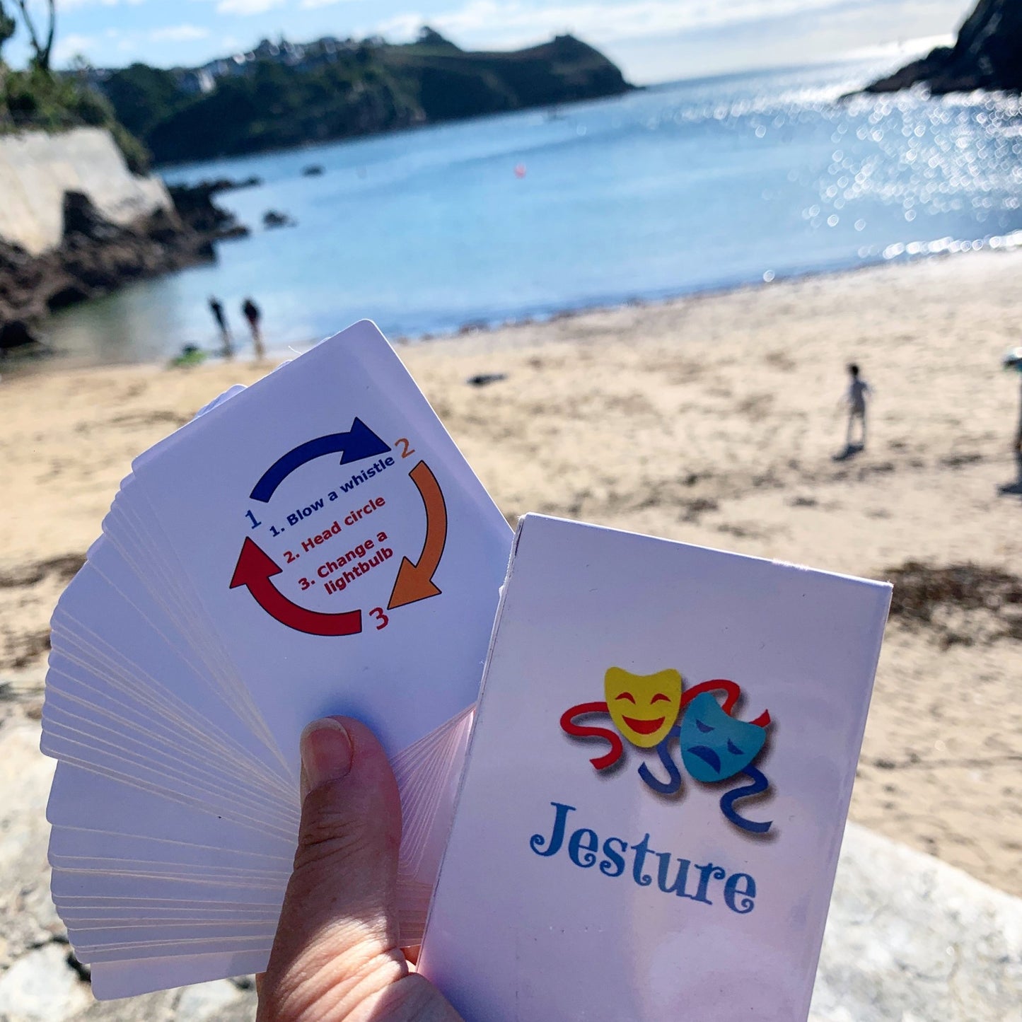 Jesture card game—fun beachside play for families, gesture duels with scenic Cornwall backdrop and quickfire action