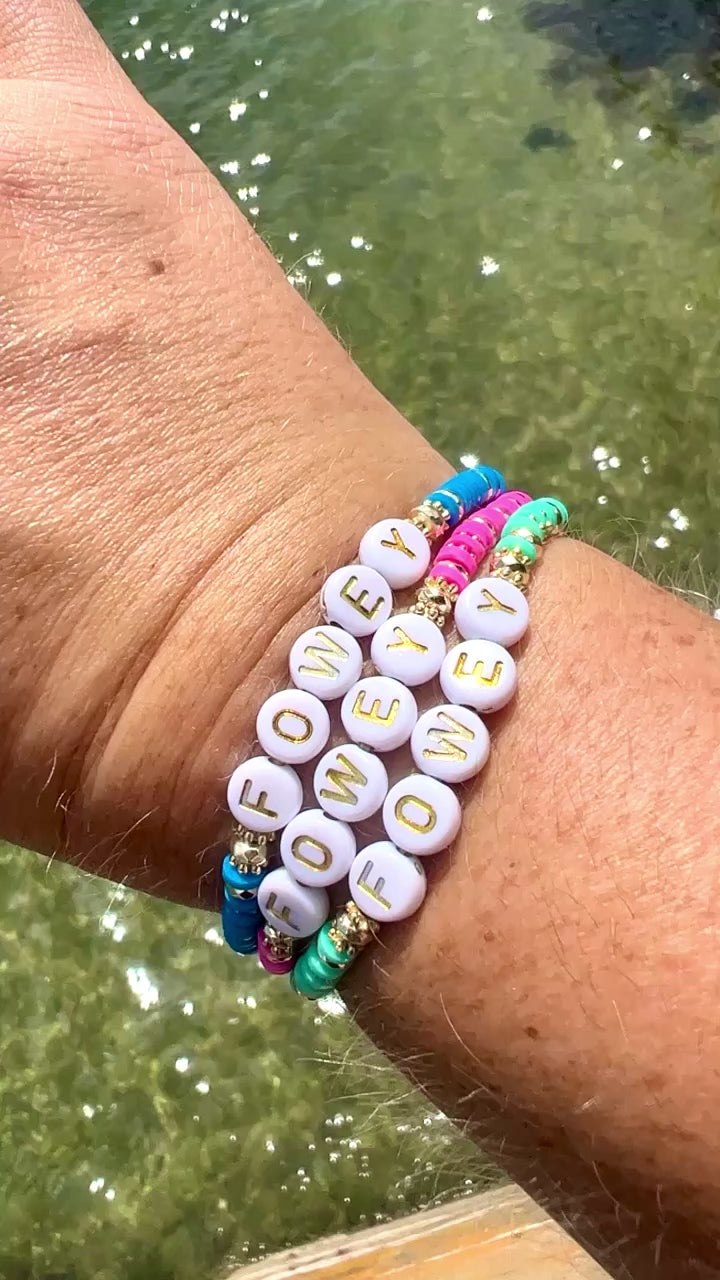 A video showing Victoria's wrist against the sea, she is wearing three Fowey beaded sweetie style bracelets