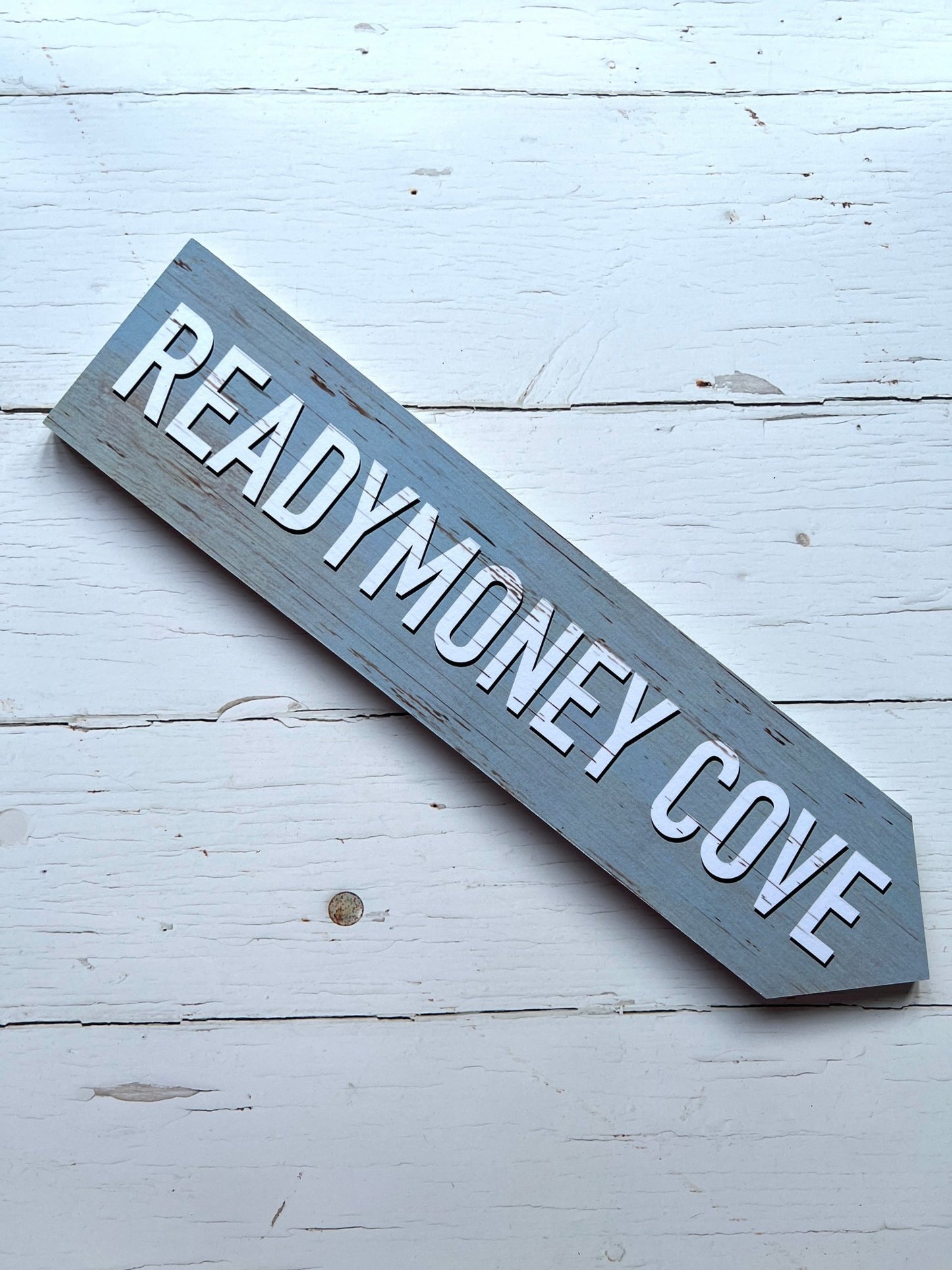grey 'Readymoney Cove' single direction arrow sign coastal beach decor, vintage effect, wooden wall art, nautical theme
