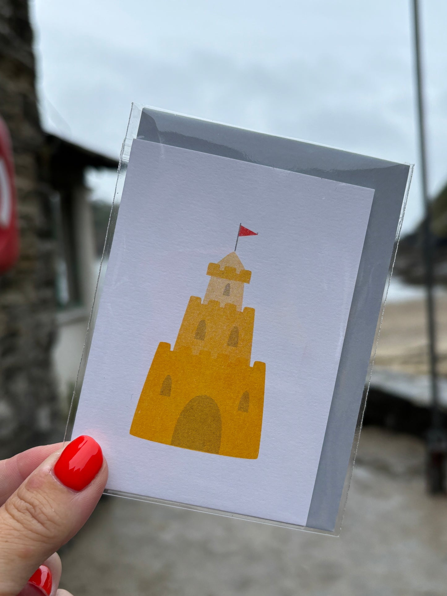 mini beach greeting card with sandcastle illustration and red flag, coastal-themed blank stationery for summer notes