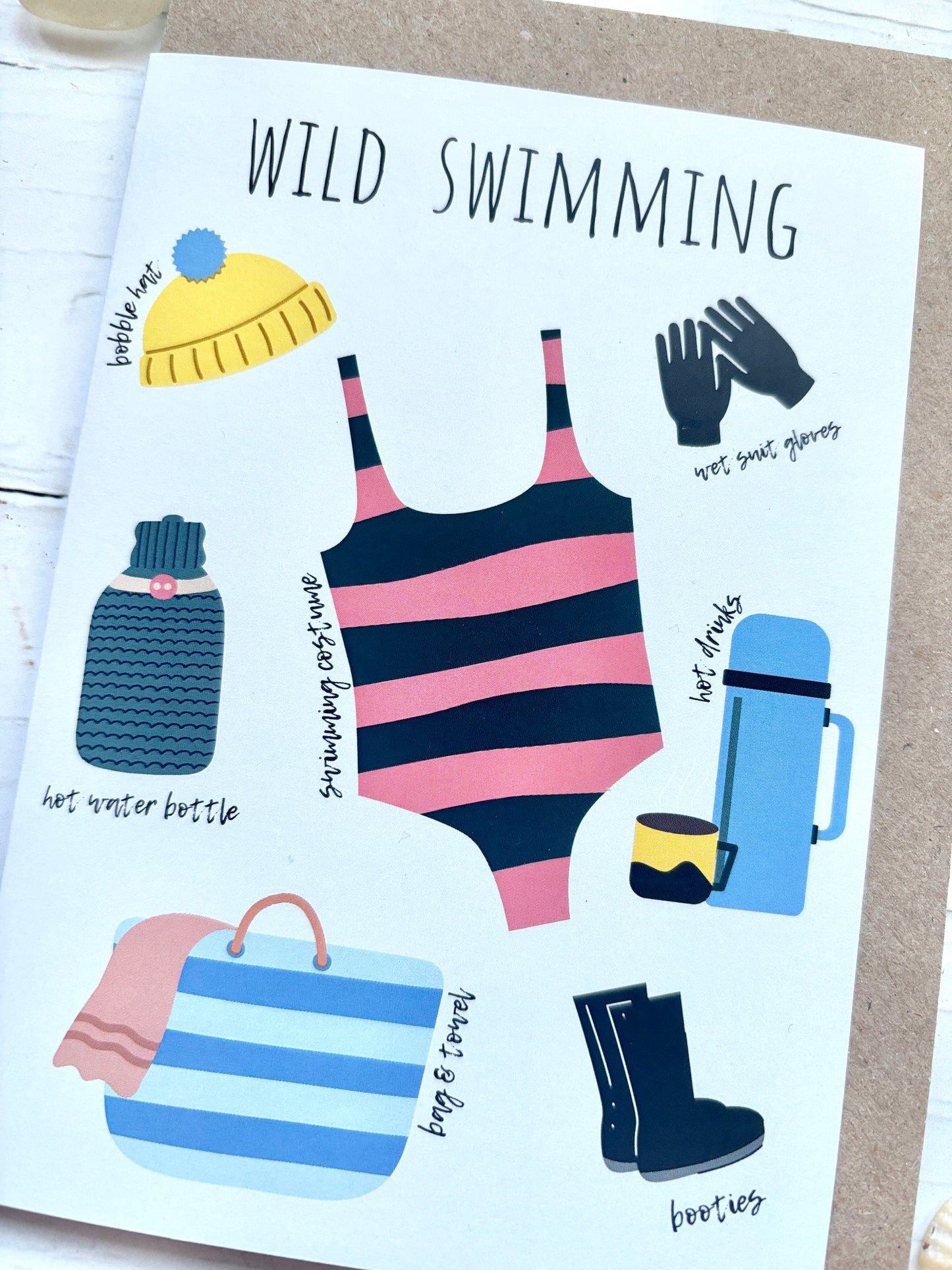 wild swimming essentials card: striped swimsuit, bobble hat, wetsuit gloves, hot water bottle, thermos, booties