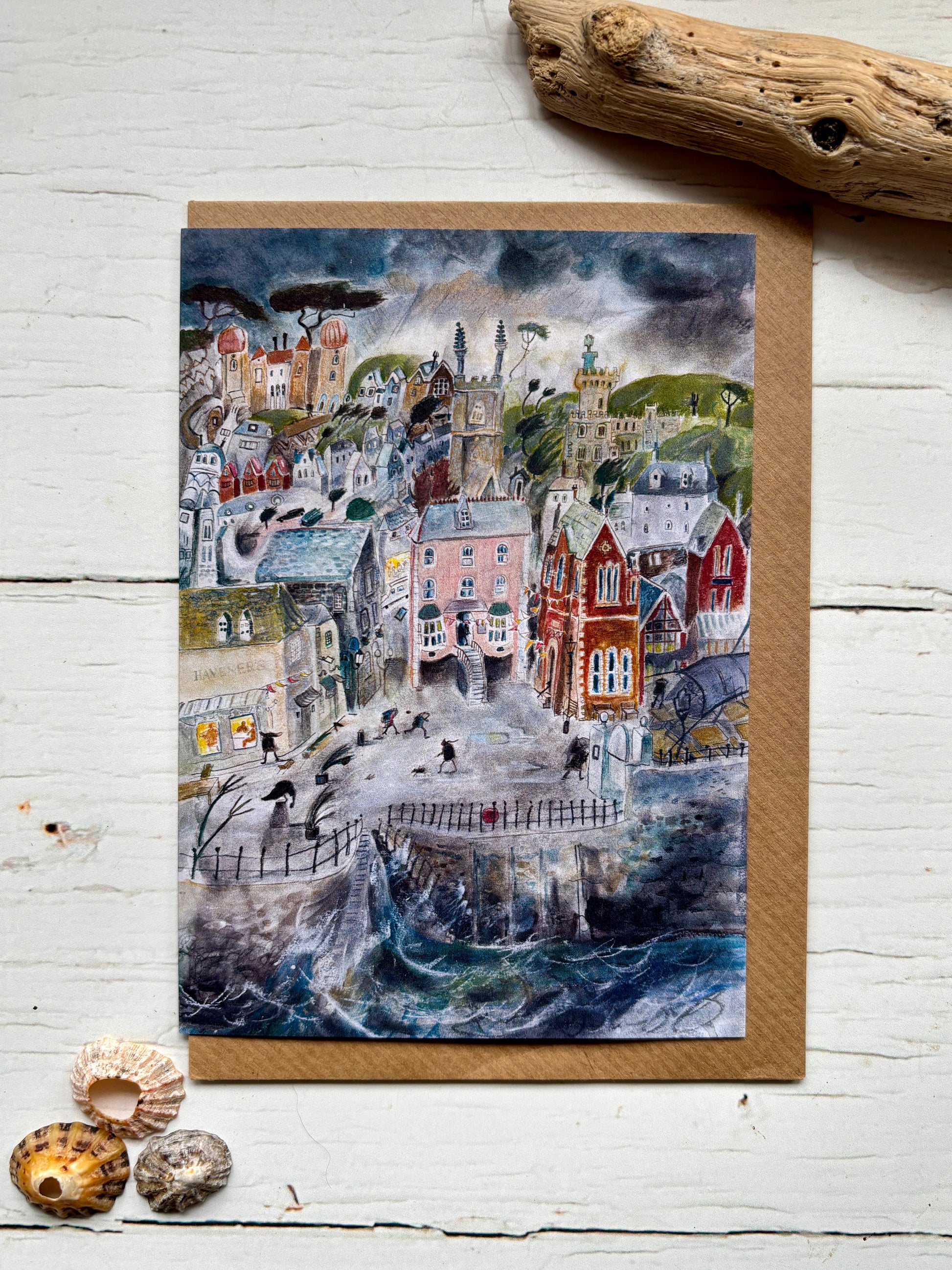 greeting card—stormy coastal town with pastel buildings, swirling waves, and moody sky for ocean lovers and art fans