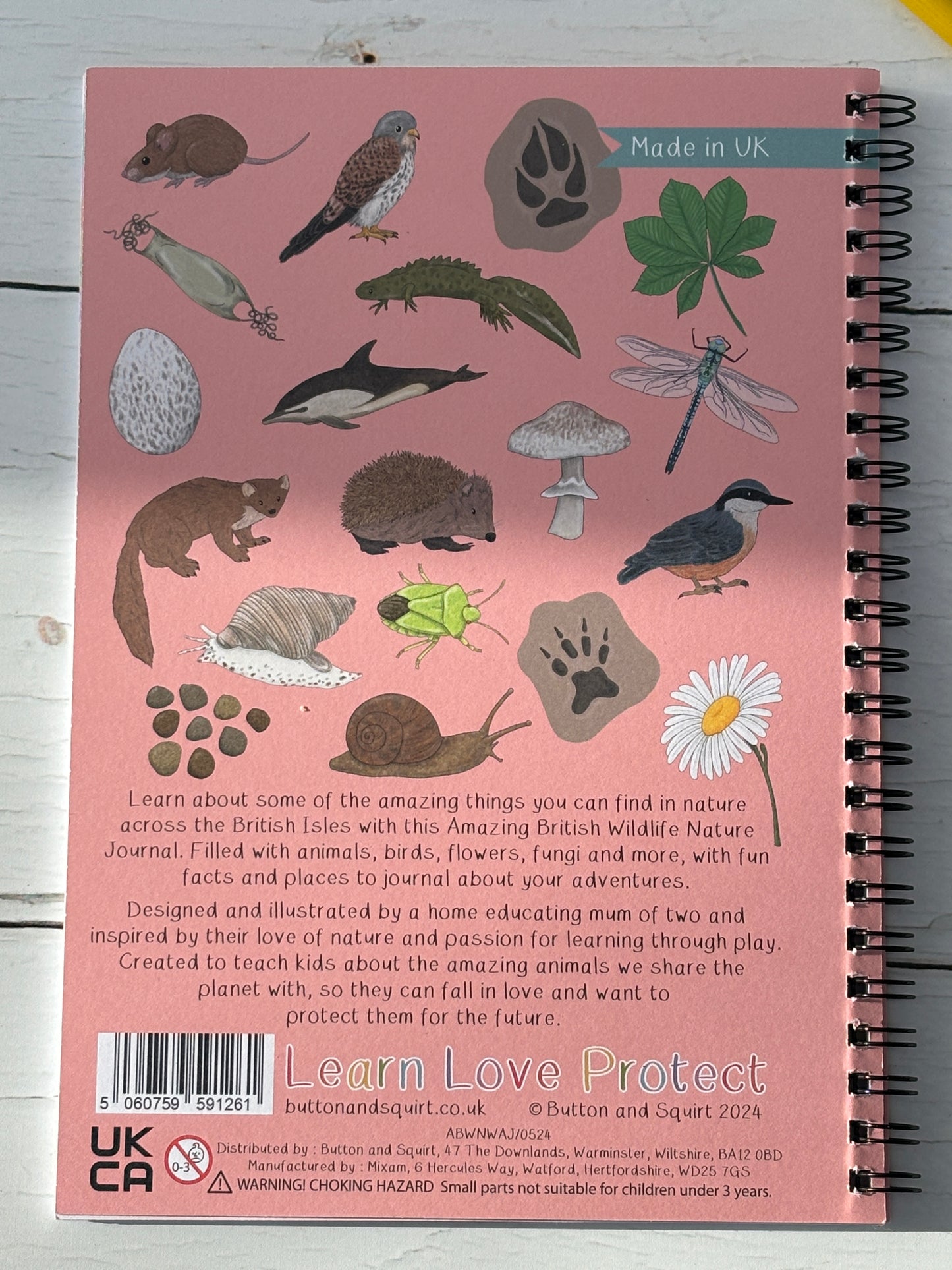 British wildlife journal back cover with illustrated animals, birds, flowers, fungi, educational nature activity book