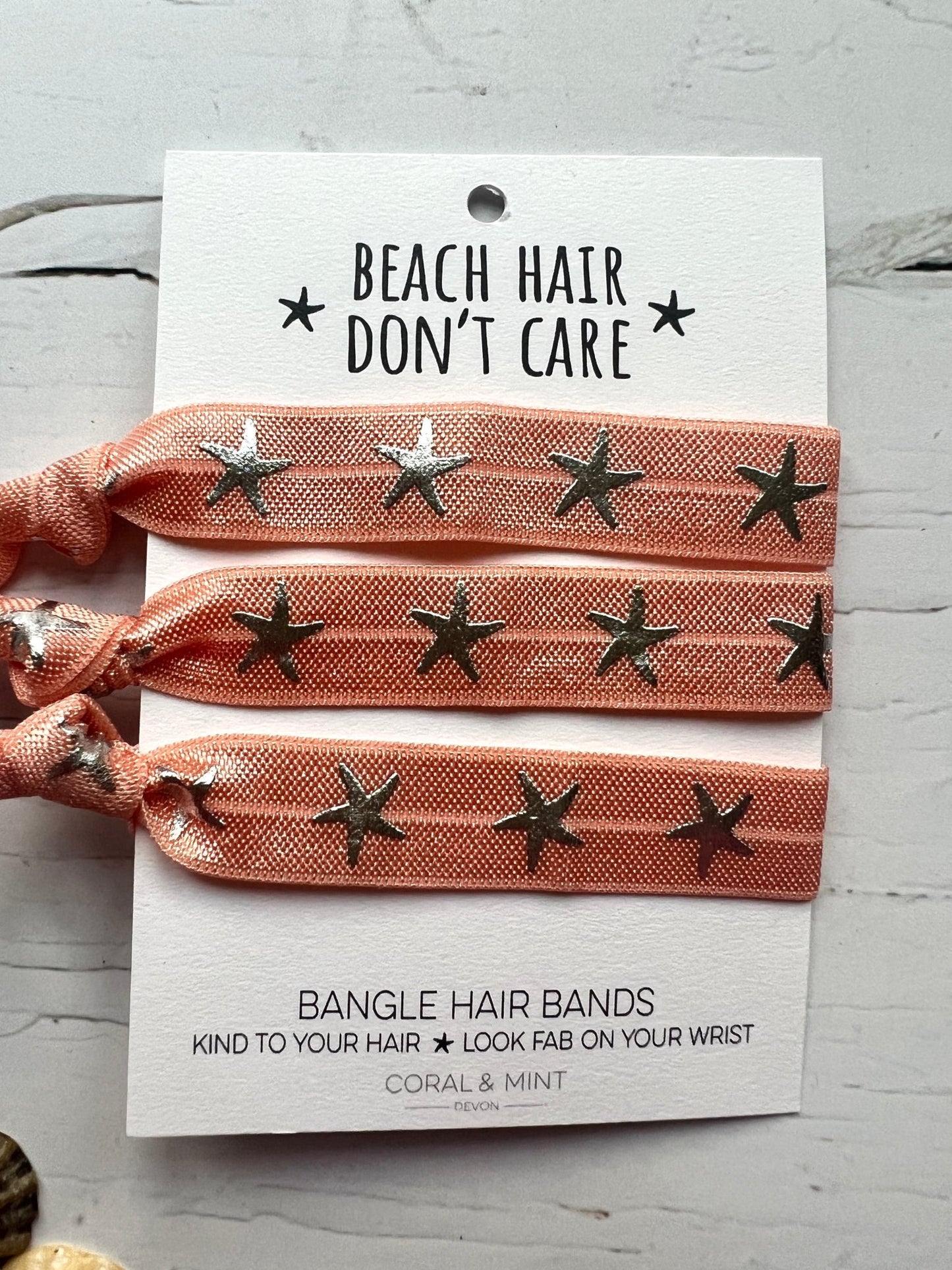 peach starfish print hair ties—beachy bangle bands that are gentle on hair and stylish on your wrist