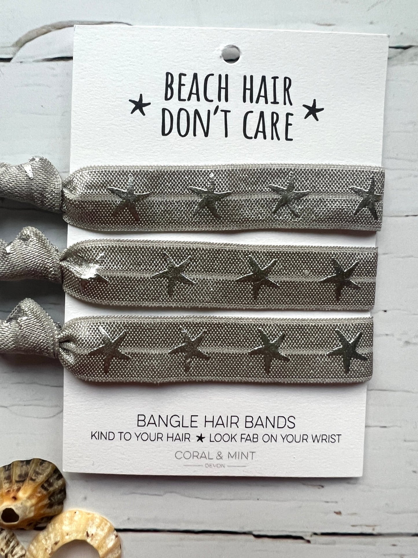 silver star hair ties—beachy bangle bands that are gentle on hair and double as chic wrist accessories
