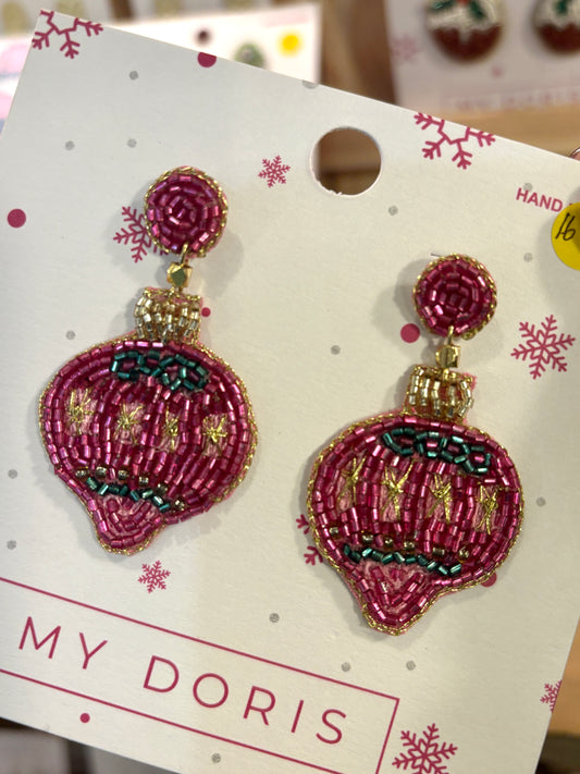 Pink bauble shaped beaded earrings on a 'My Doris' branded card with snowflake designs.