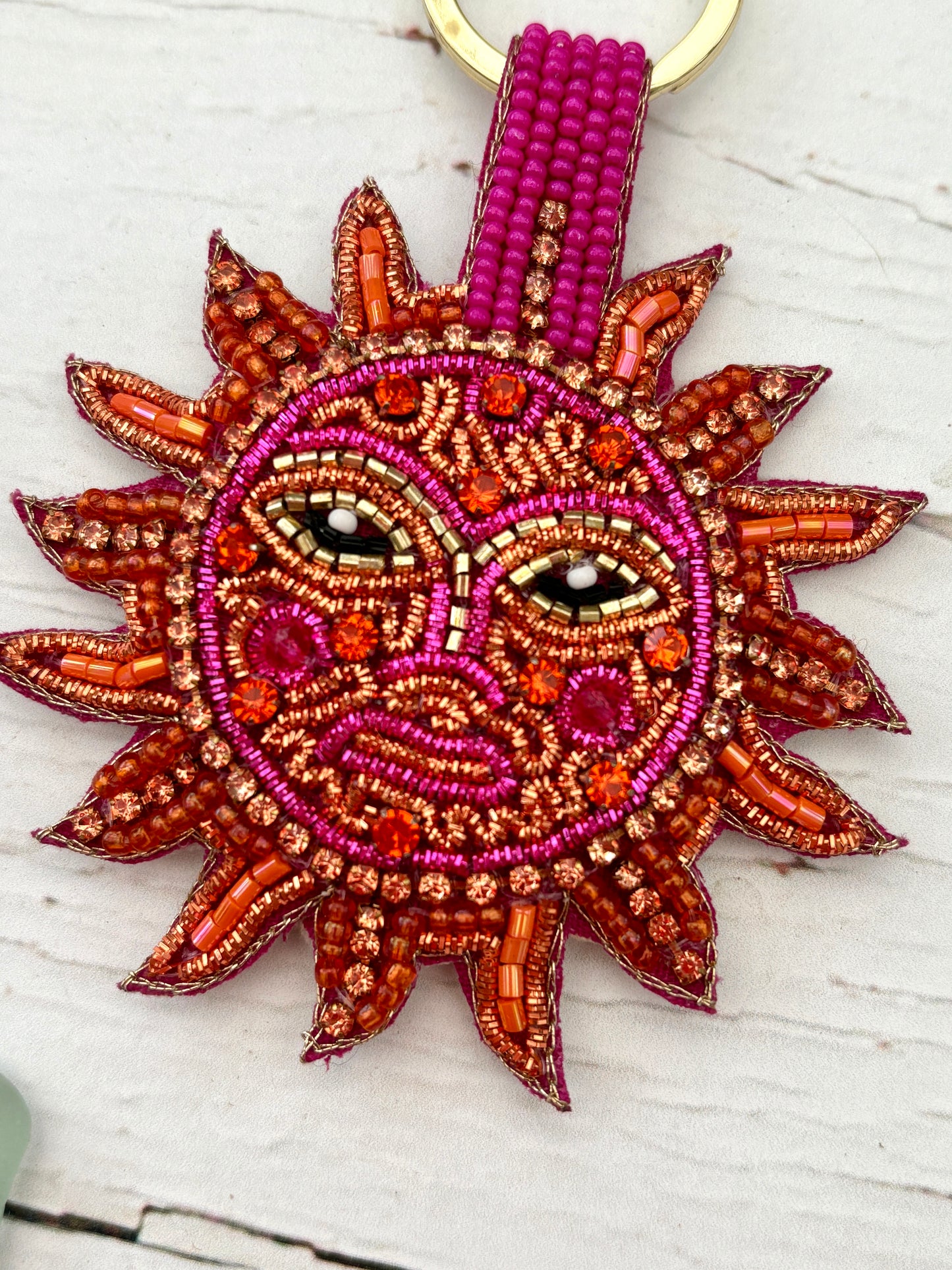 beaded sunshine face key ring close up