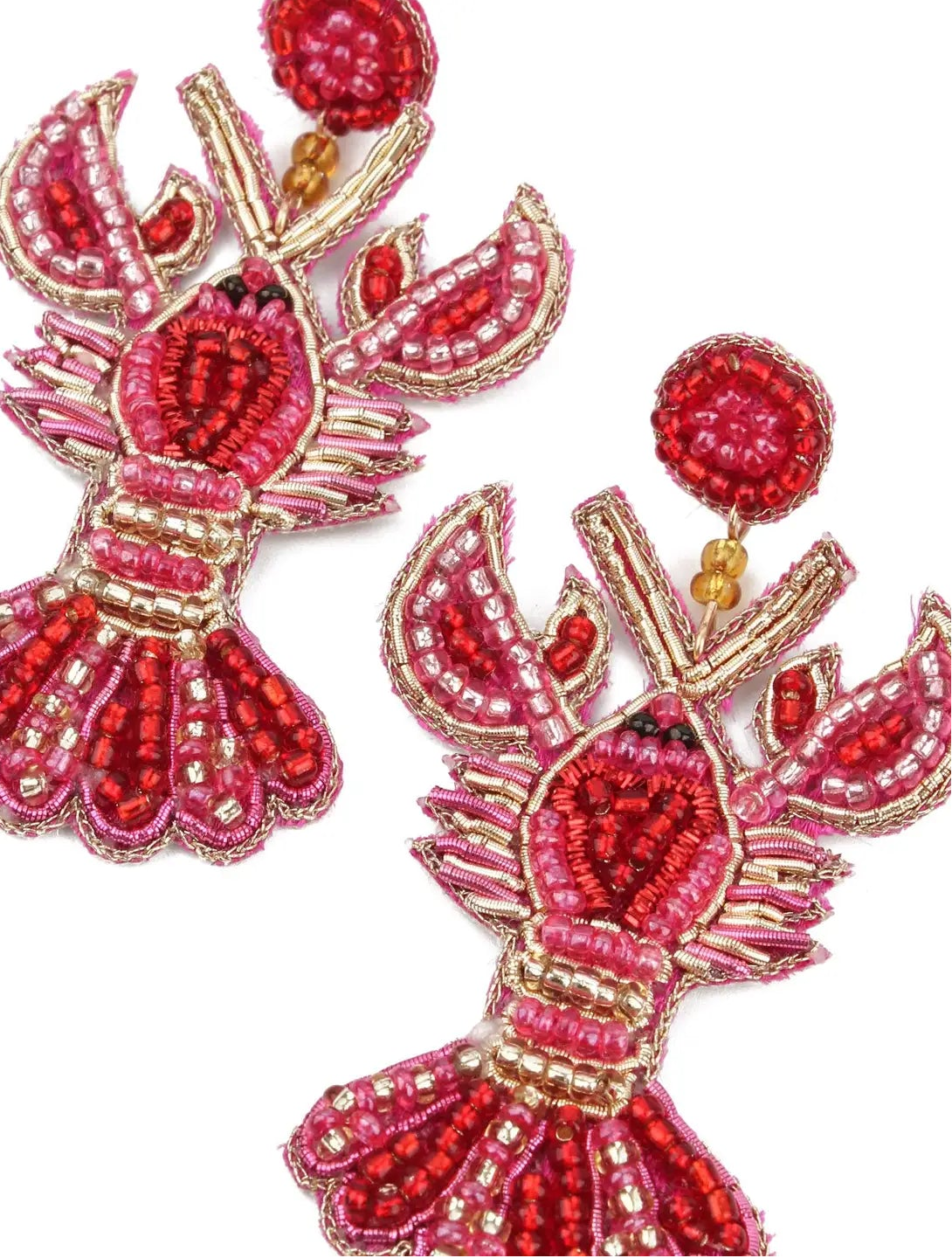 Pair of red and gold lobster-shaped earrings on a white background