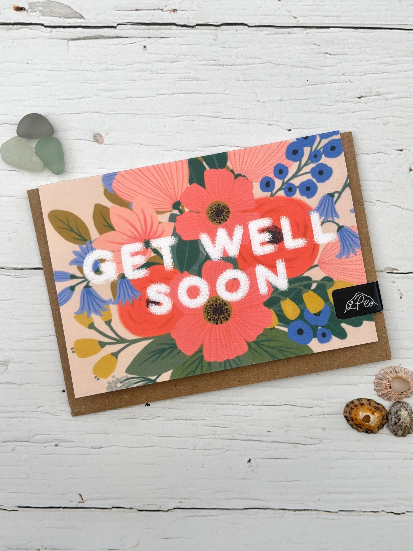floral get well soon card—vibrant blooms in pink, blue, and yellow with bold white lettering for heartfelt wishes