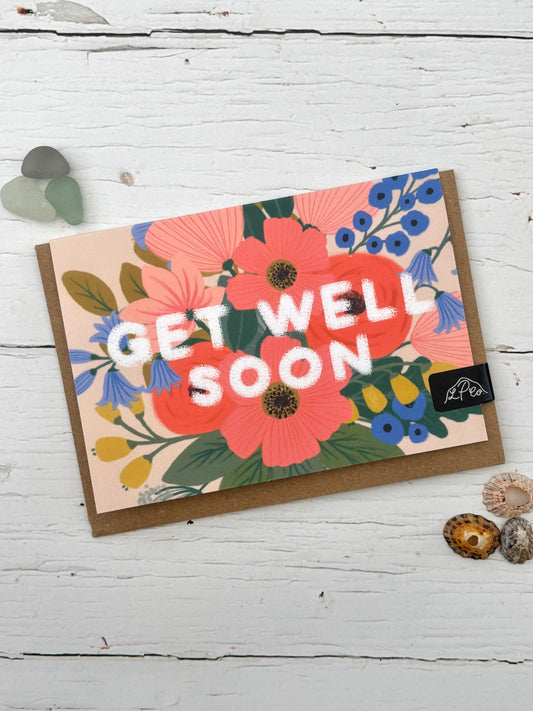 floral get well soon card—vibrant blooms in pink, blue, and yellow with bold white lettering for heartfelt wishes