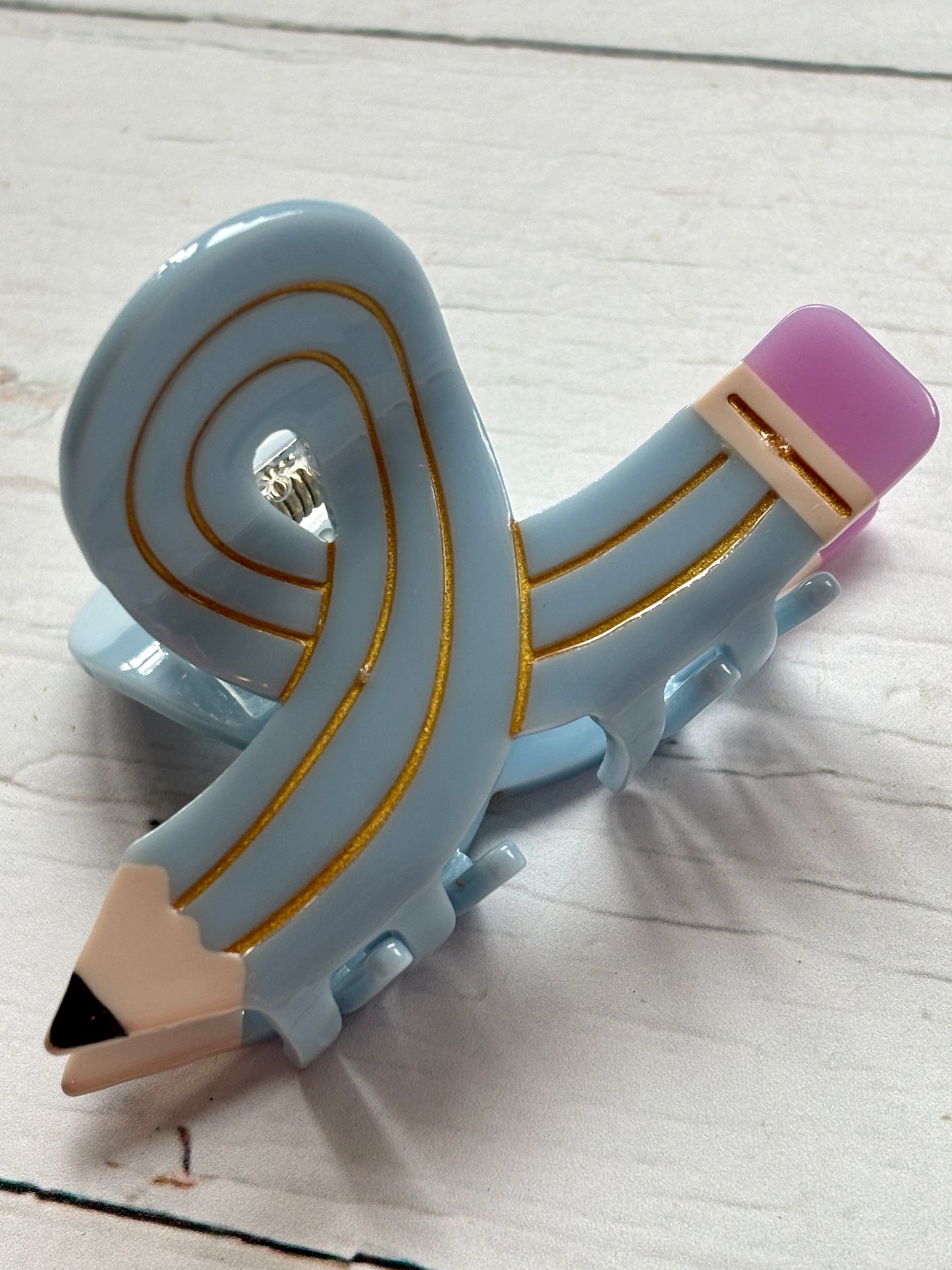 playful light blue pencil hair claw clip, curled like a ribbon, with pink eraser detail unique writing-themed hair accessory