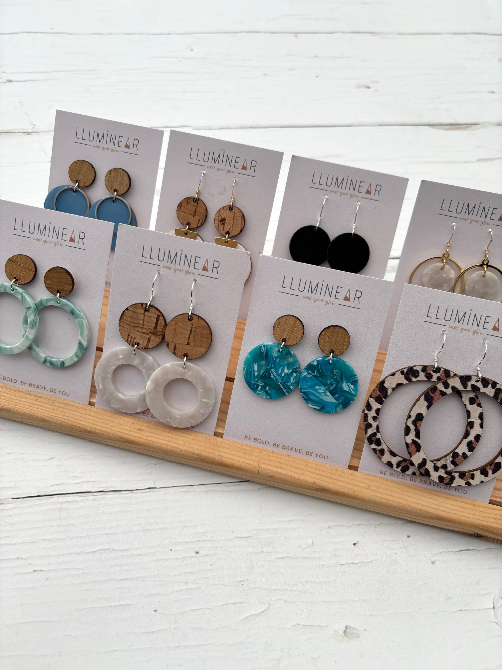 bold dangly earrings with wood tops and vibrant prints; handcrafted statement jewelry for everyday wear