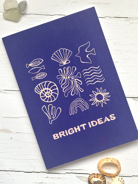“Bright Ideas” coastal notebook in navy—sea-themed icons on recycled cover, perfect for eco-friendly journaling and gifting