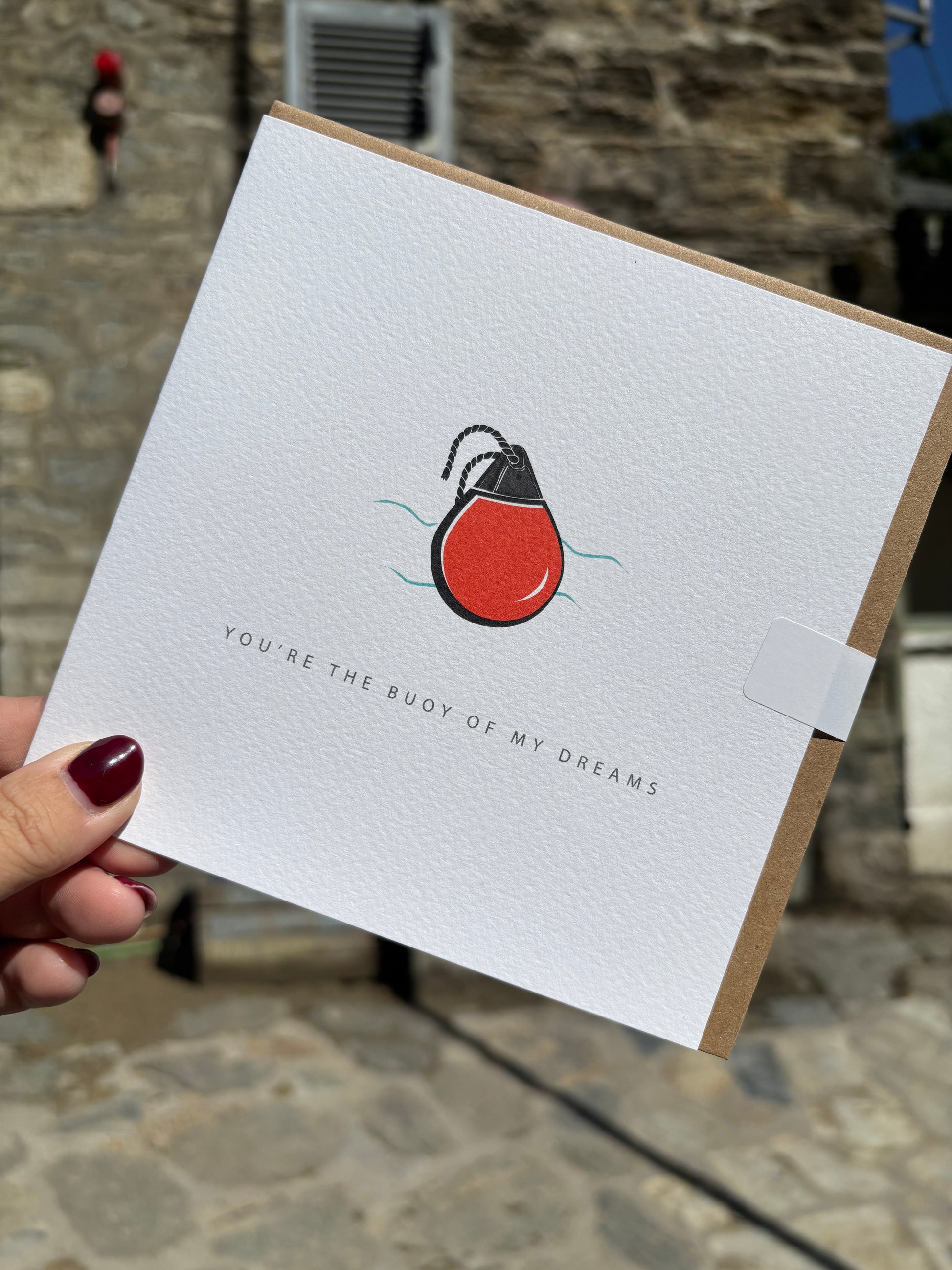 nautical card with a red flotation buoy art. Romantic pun-based stationery: "Buoy Of My Dreams." coastal love note