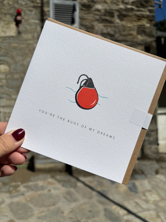 nautical card with a red flotation buoy art. Romantic pun-based stationery: "Buoy Of My Dreams." coastal love note