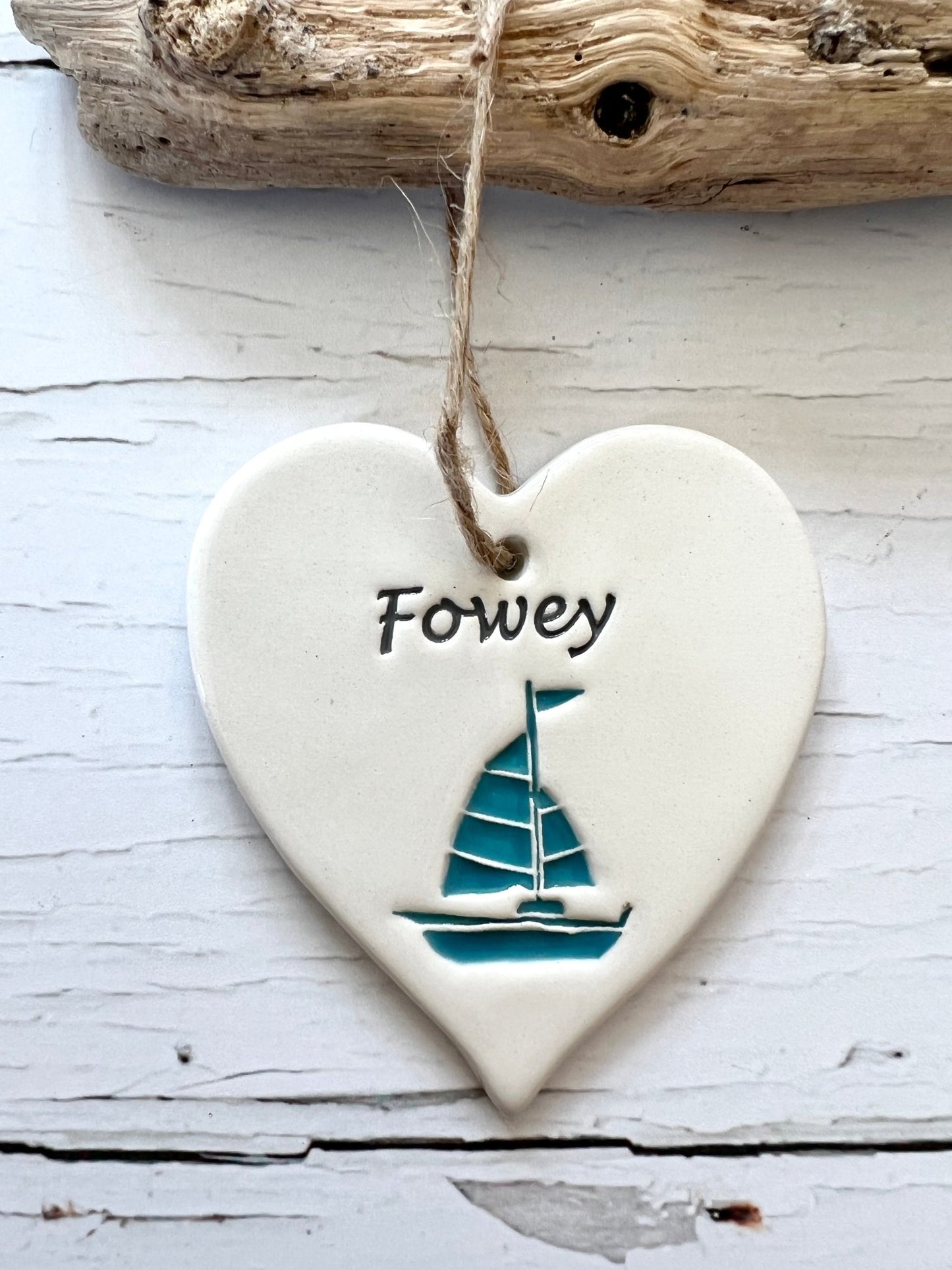 Fowey ceramic heart hanging decoration with a teal sailboat coastal art, seaside home decor, Cornish gift, nautical, handcrafted pottery