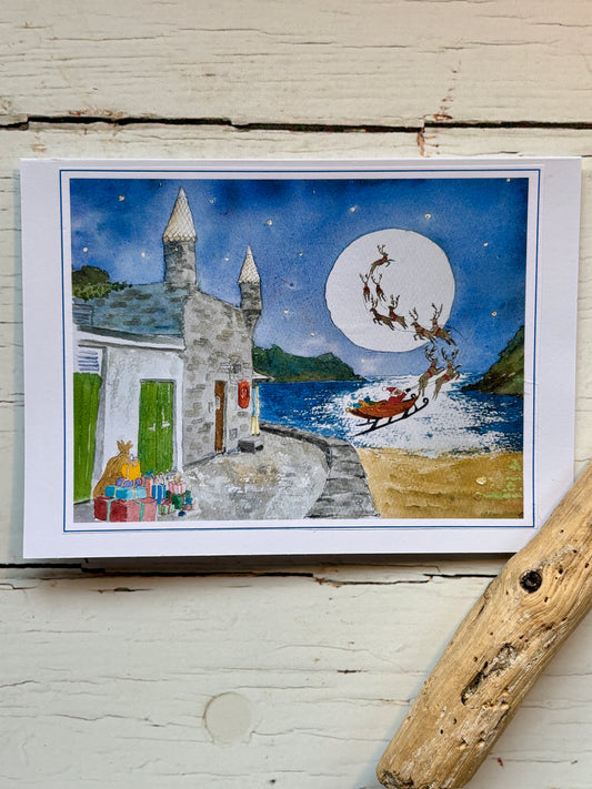 Christmas at Readymoney Cove watercolor card santa and sleigh over the sea by the castle Cornish Christmas cards, seaside holiday