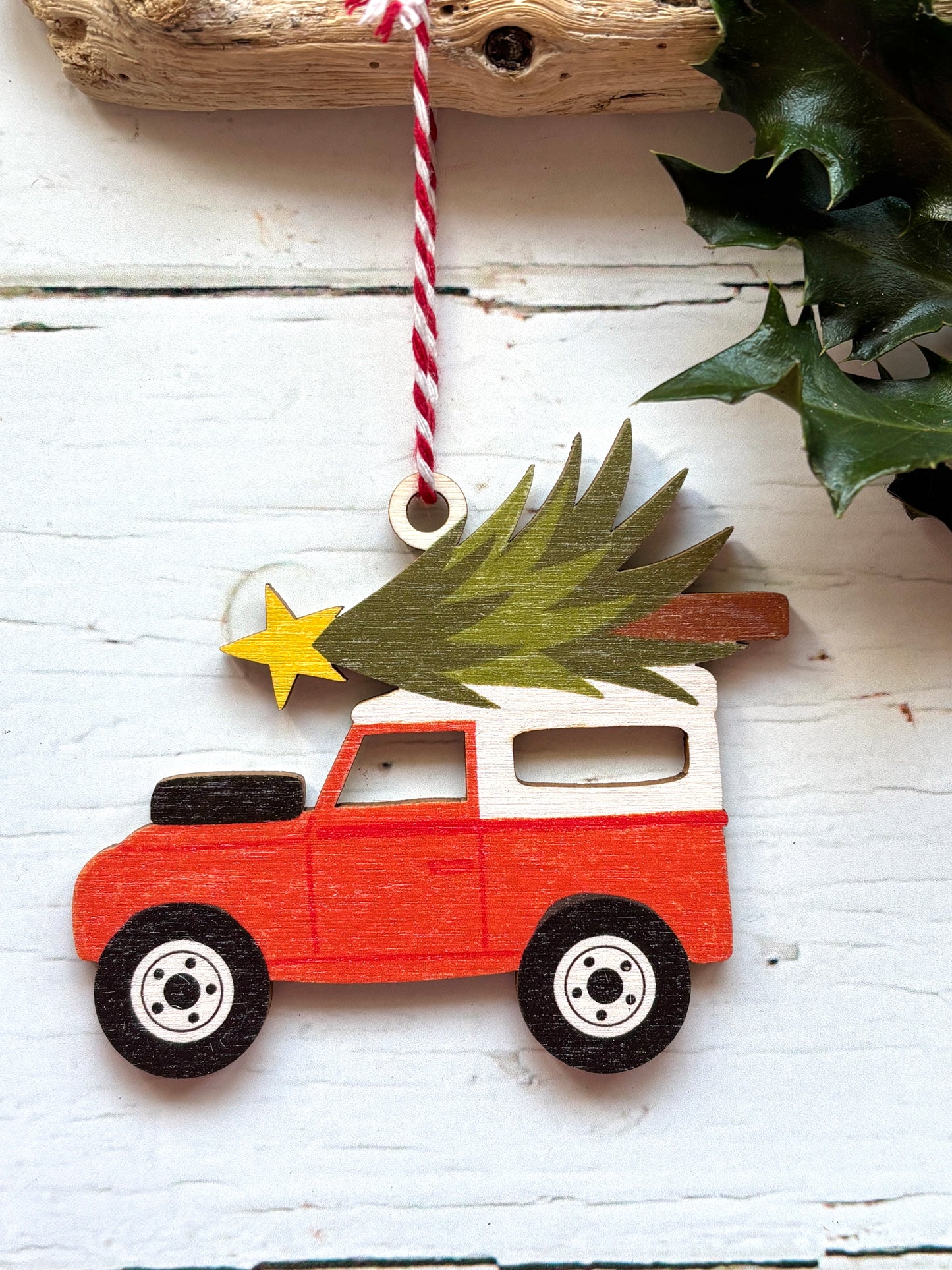 wooden red and white Land Rover decor off-road vehicle Christmas tree and star on top retro vehicle holiday decor