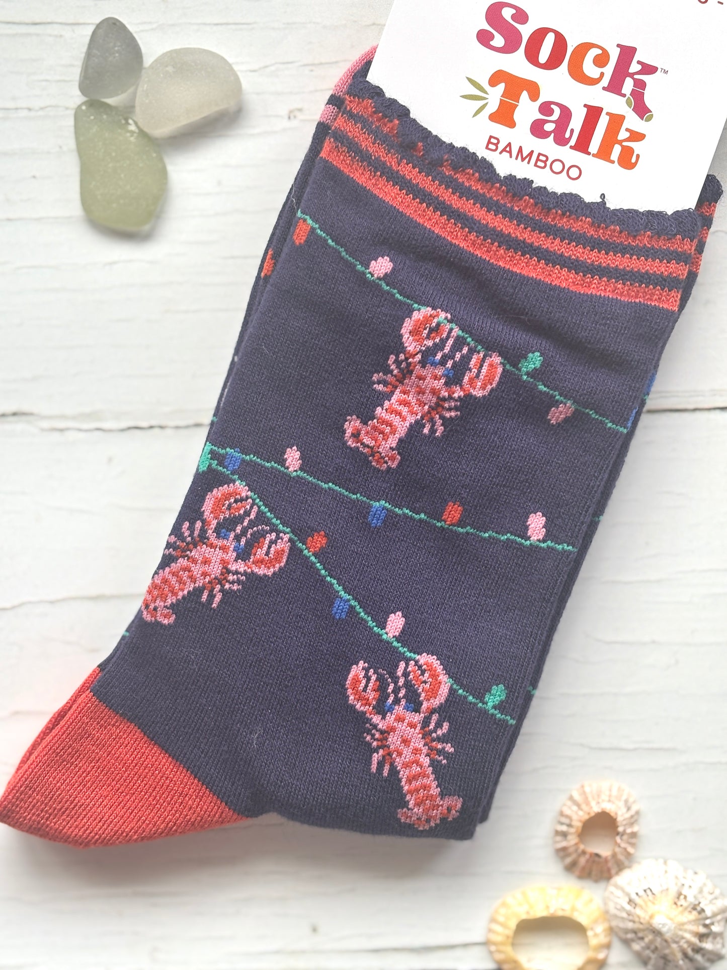 novelty Christmas lobster socks dark blue bamboo with a pattern of pink lobsters and string lights coastal holiday apparel