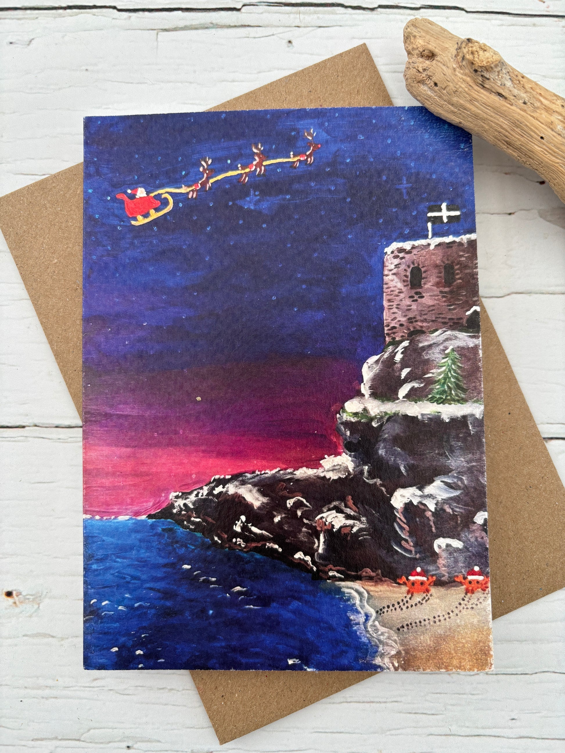 St Catherine's Castle Christmas Card watercolour painting of Santa and reindeer over a snowy Cornish coastline seaside holiday cards