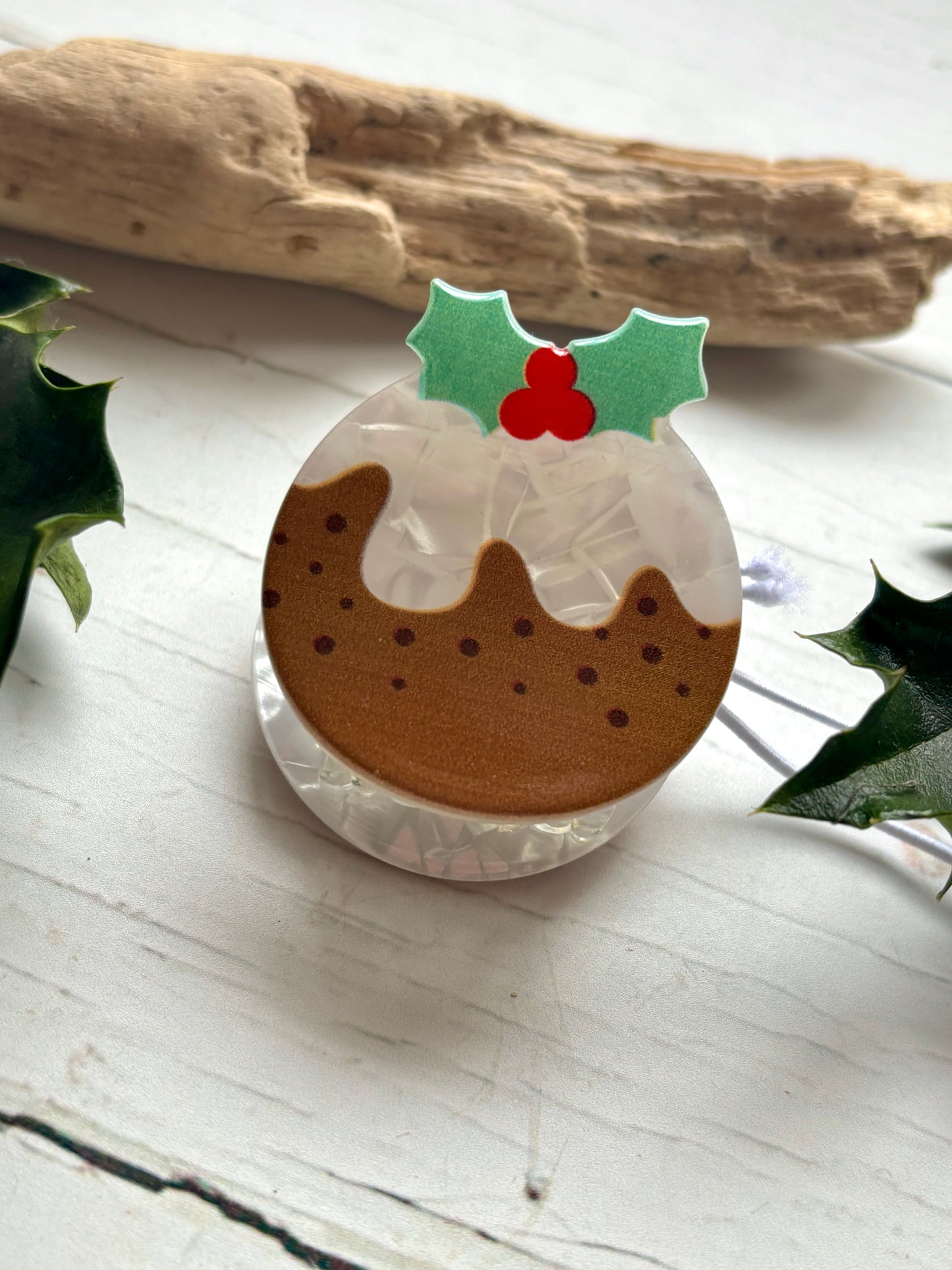 Christmas pudding hair claw holiday clip with brown pudding, white frosting, and holly leaf detail festive foodie accessory