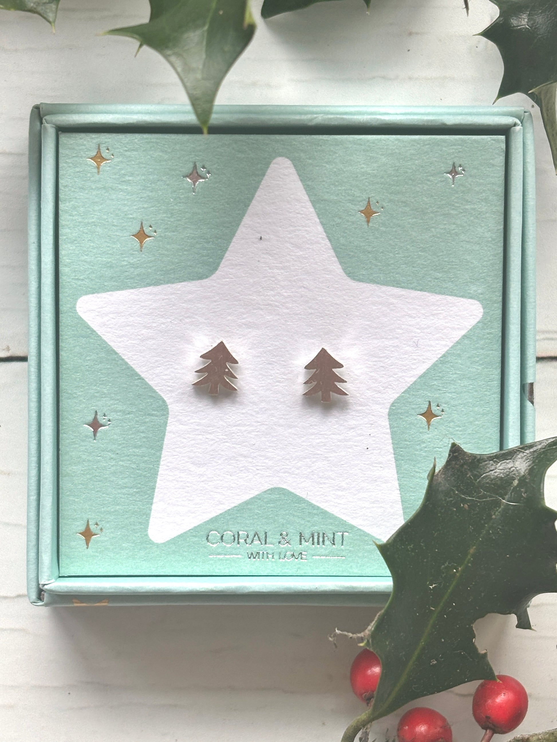 Christmas tree stud earrings—silver festive tree design on star card with holly, perfect for seasonal jewelry, gifting, and outfits