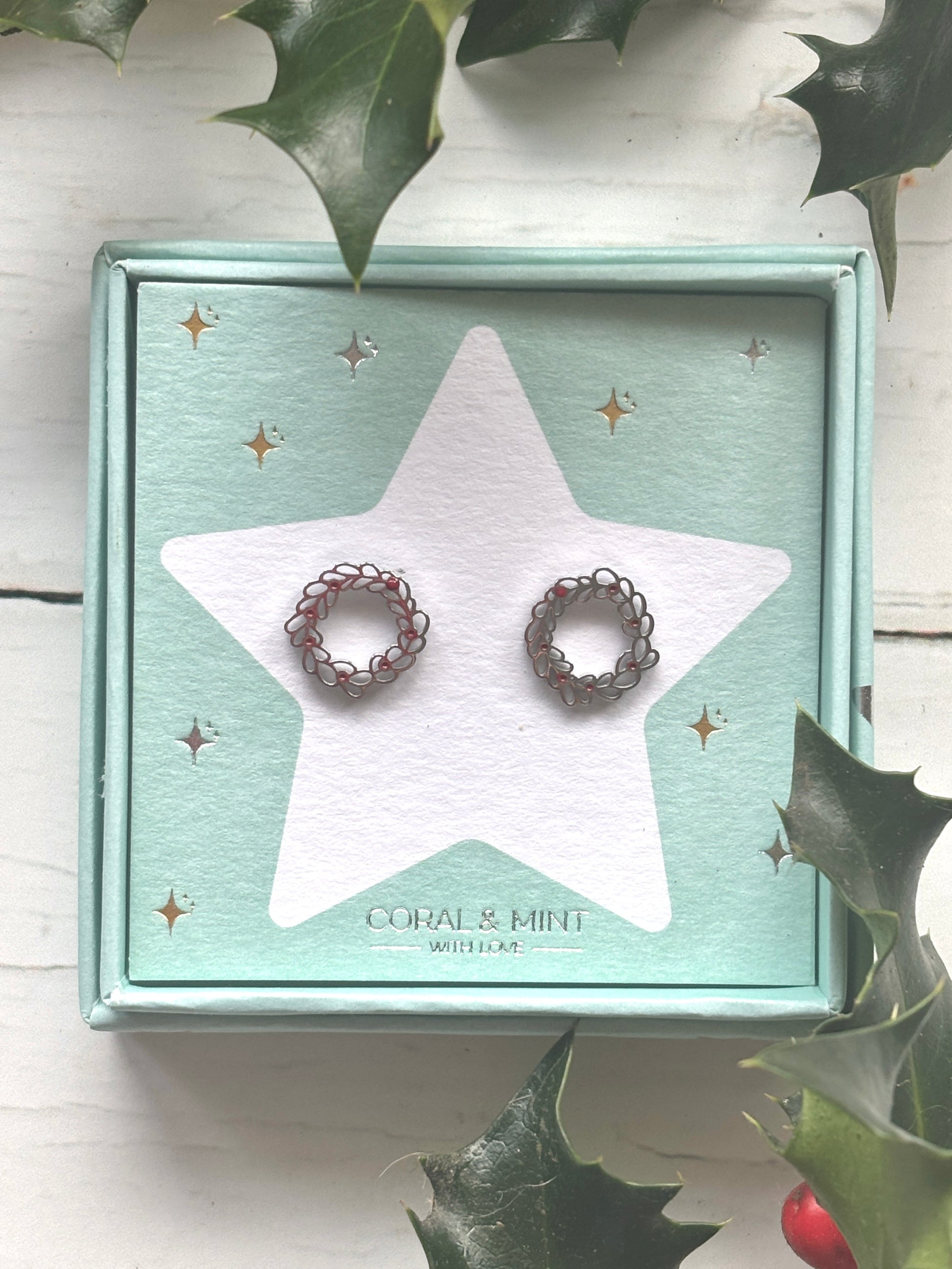 Christmas Wreath stud earrings—silver loops with red accents on festive card, ideal for holiday jewelry, gifting, and stocking fillers
