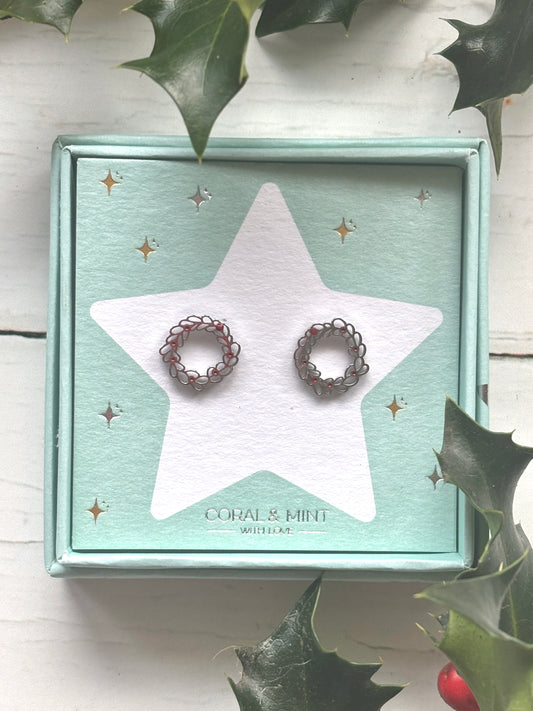 Christmas Wreath stud earrings—silver loops with red accents on festive card, ideal for holiday jewelry, gifting, and stocking fillers