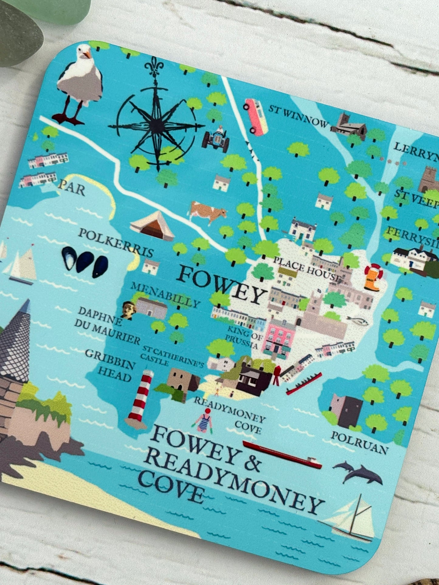 closeup shot of Fowey map coaster nautical illustration, blue water, Gribbin Head lighthouse, Polruan, Readymoney Cove detail