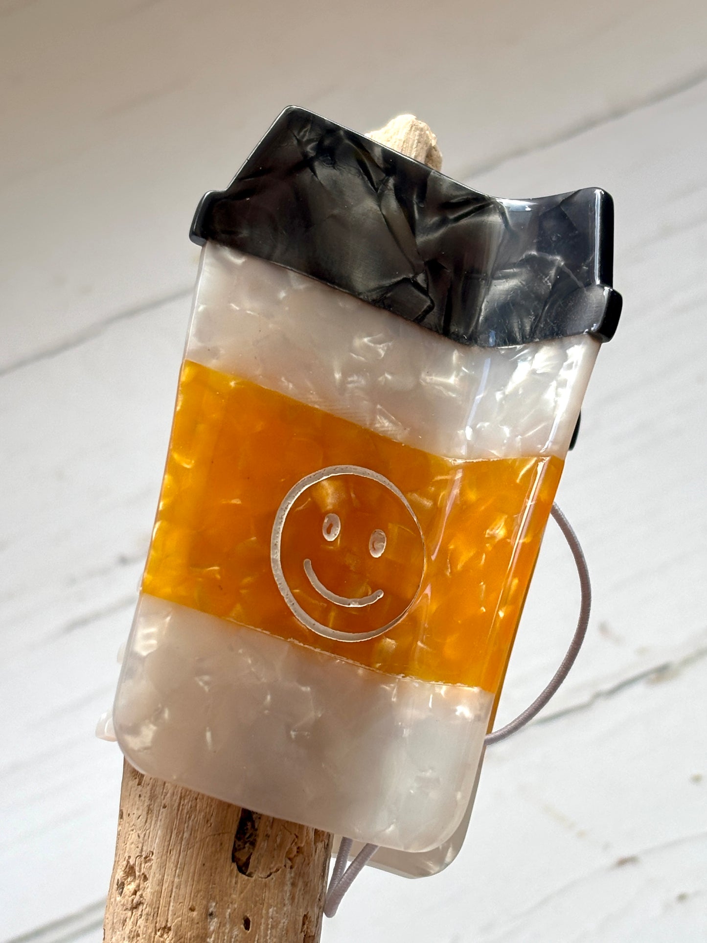 glossy marbled coffee cup hair clip with smiley face—cute, quirky accessory for coffee lovers and gift-givers