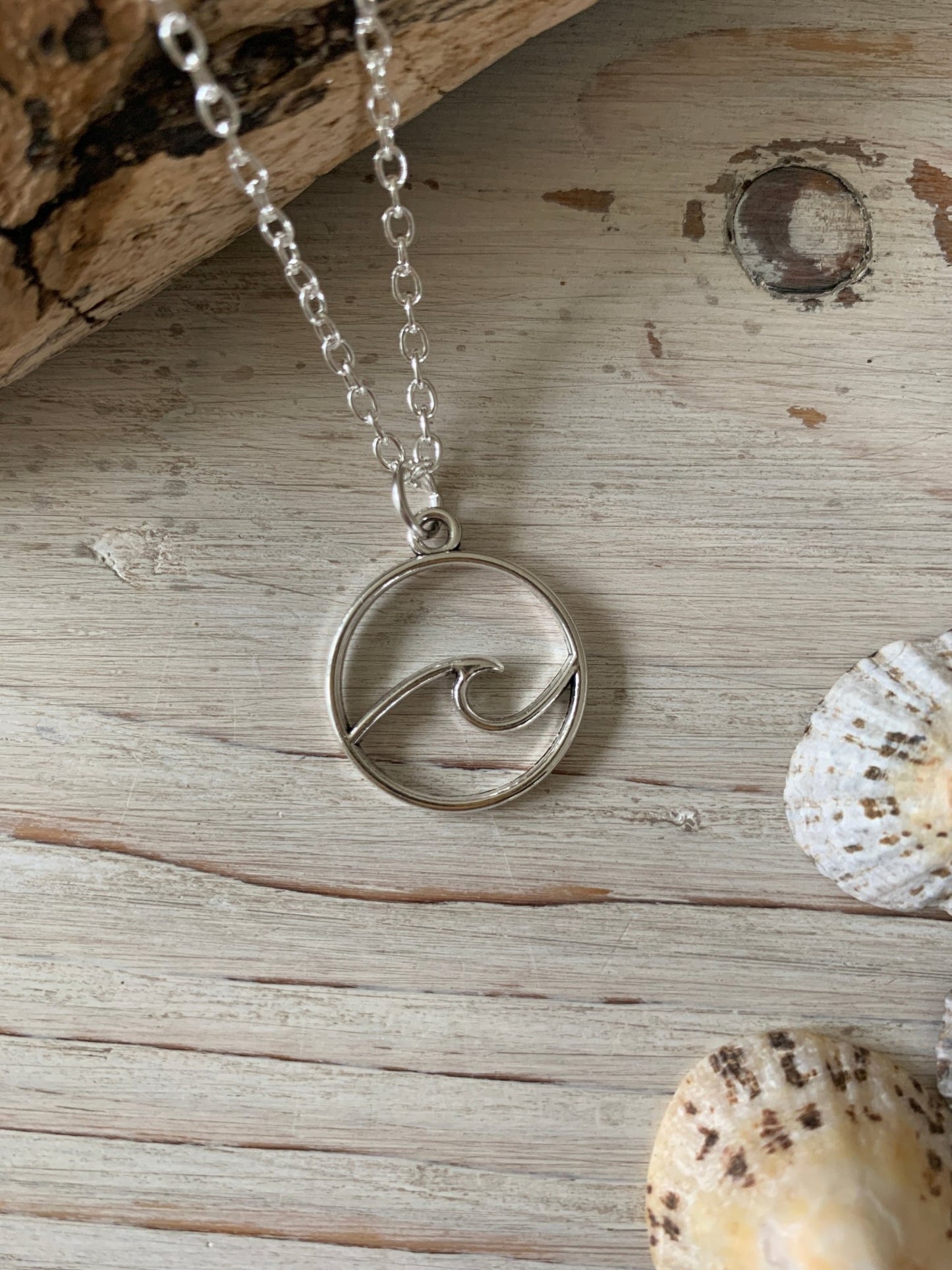 silver wave charm necklace ocean jewelry pendant with simple geometric wave design surfer coastal fashion gift