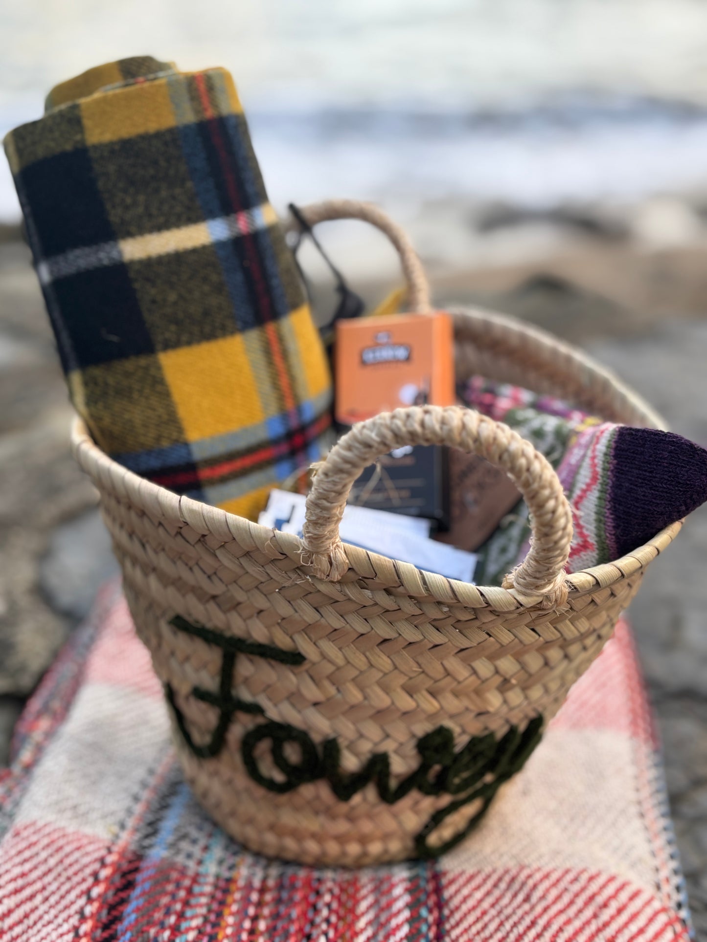 Cornish comfort Fowey gift basket tartan blanket, knitted socks, Kernow chocolate in embroidered straw hamper Christmas gift
