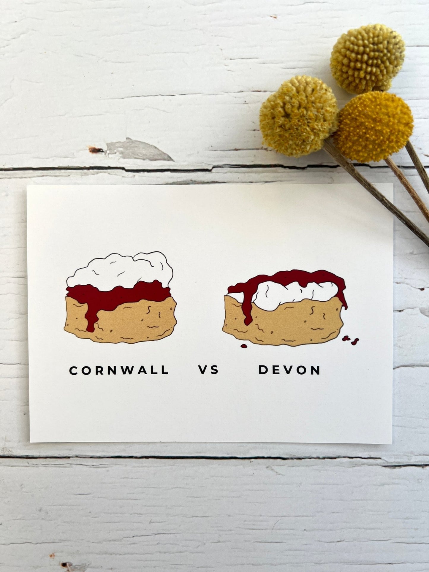 "Cornwall vs Devon" cream tea postcard funny illustration of the clotted cream vs jam debate on scones Cornish gift