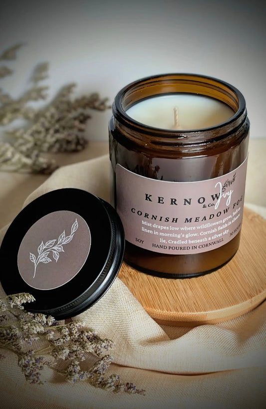 Kernow & Ivy Cornish meadow fog scented soy candle in an amber jar with its lid off luxury hand poured in Cornwall home fragrance