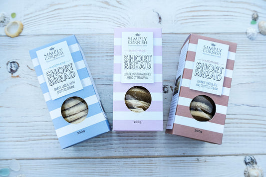 Simply Cornish handmade shortbread biscuits in striped boxes with clotted cream, strawberry and chocolate flavors