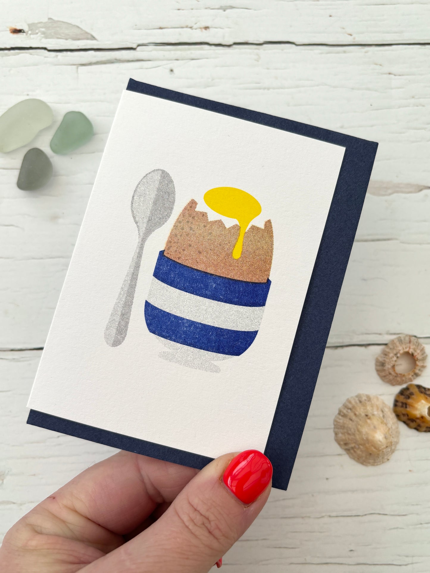 blue striped egg cup greeting card with spoon, navy envelope, coastal breakfast design, seaglass shells decor