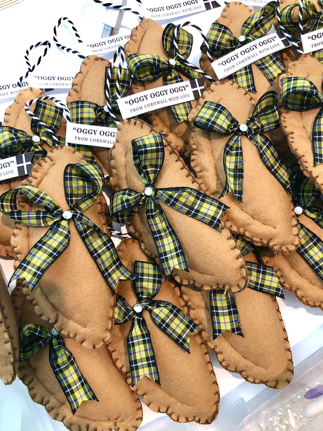 felt Cornish pasty ornaments, green yellow plaid tartan ribbons, "Oggy Oggy from Cornwall" gift tags, novelty decor