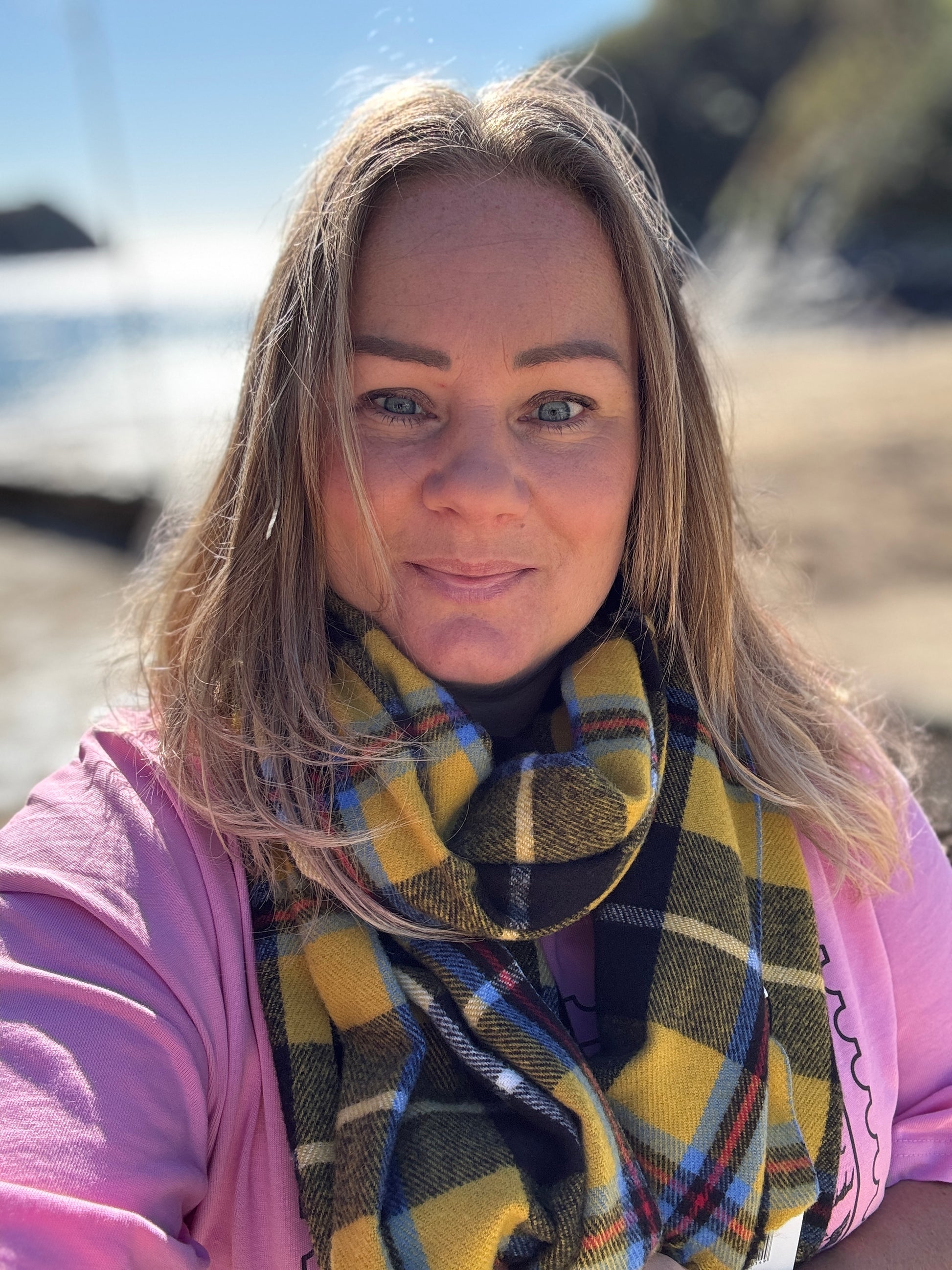 Cornish tartan scarf in bold yellow plaid—coastal heritage accessory styled at the beach, perfect for gifting and seasonal layering