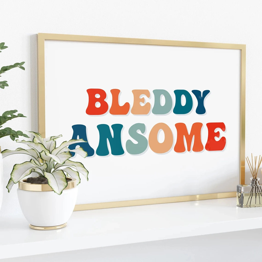 Lifestyle view of 'BLEDDY ANSOME' print wall art with bold, colorful, retro font modern home decor accent