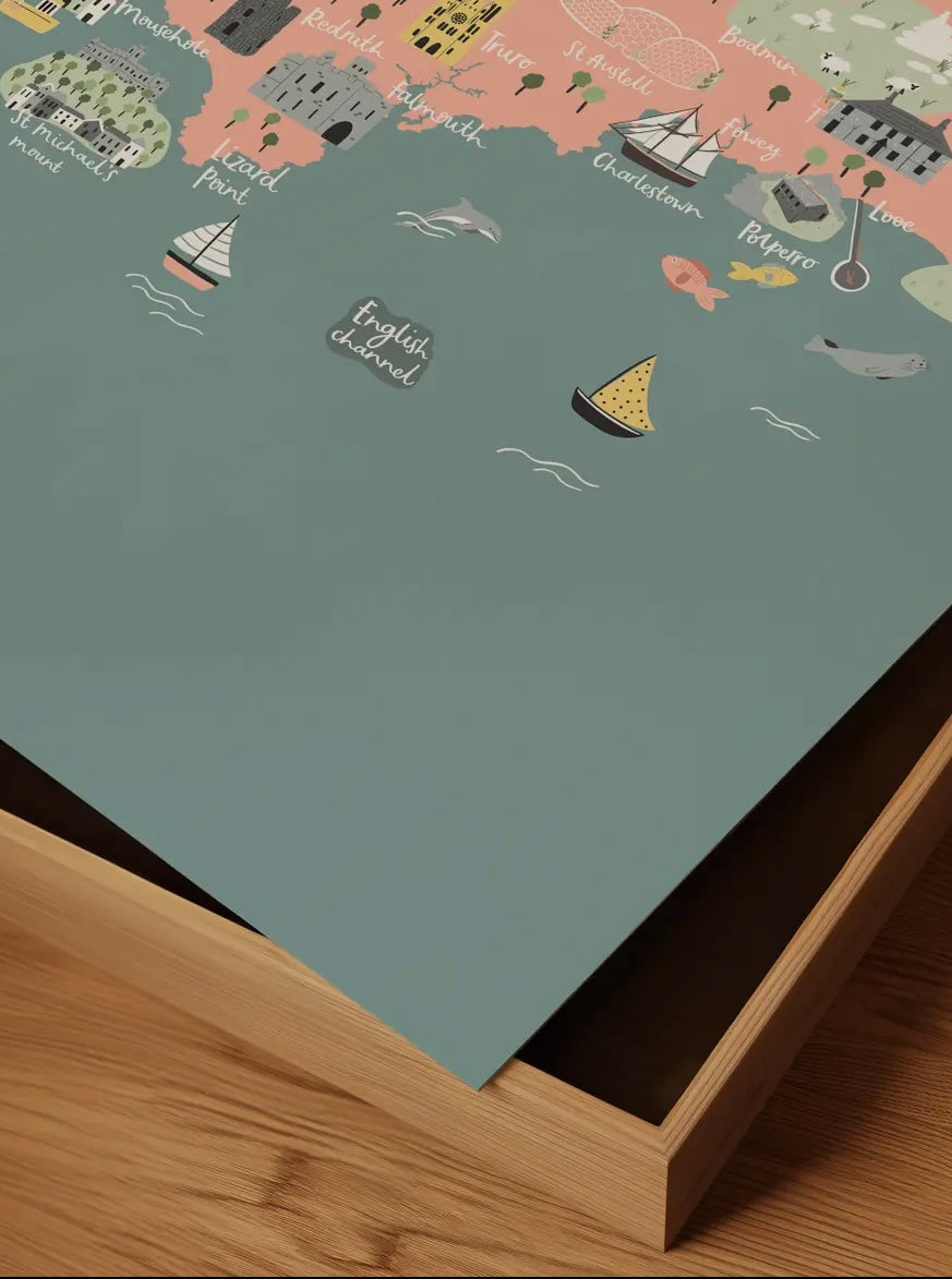 closeup shot of hand-illustrated Cornwall map details of the English Channel, Lizard Point, and sailing boats Coastal home decor