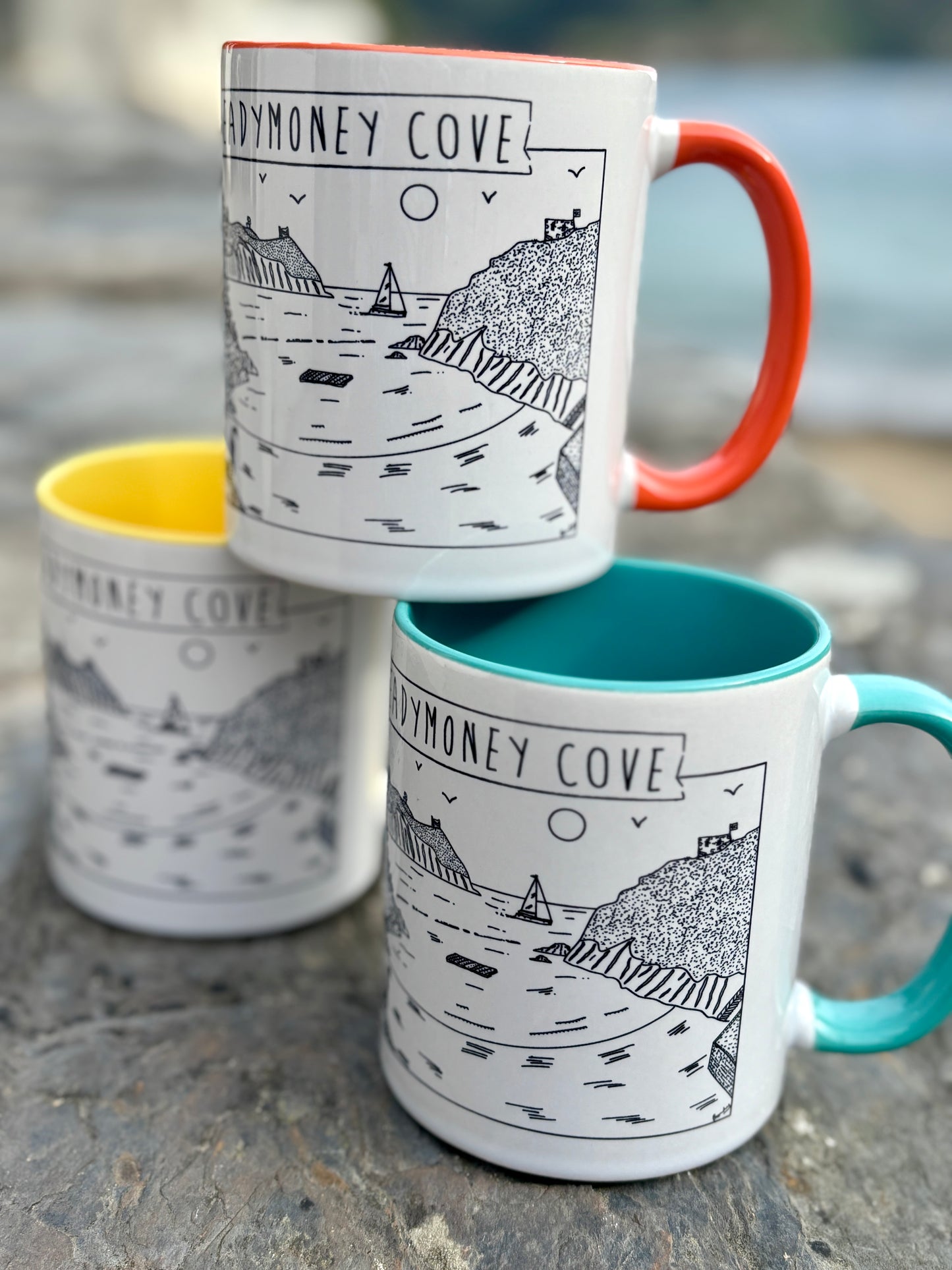 readymoney cove mug close-up with coastal illustration, vibrant handles, and seaside flair—perfect beach lover’s holiday gift