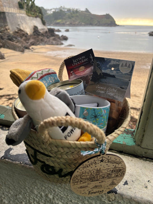 deluxe Cornish Christmas gift basket Fowey straw hamper with penguin soft toy, chocolate, fudge, and mug. Luxury holiday gift