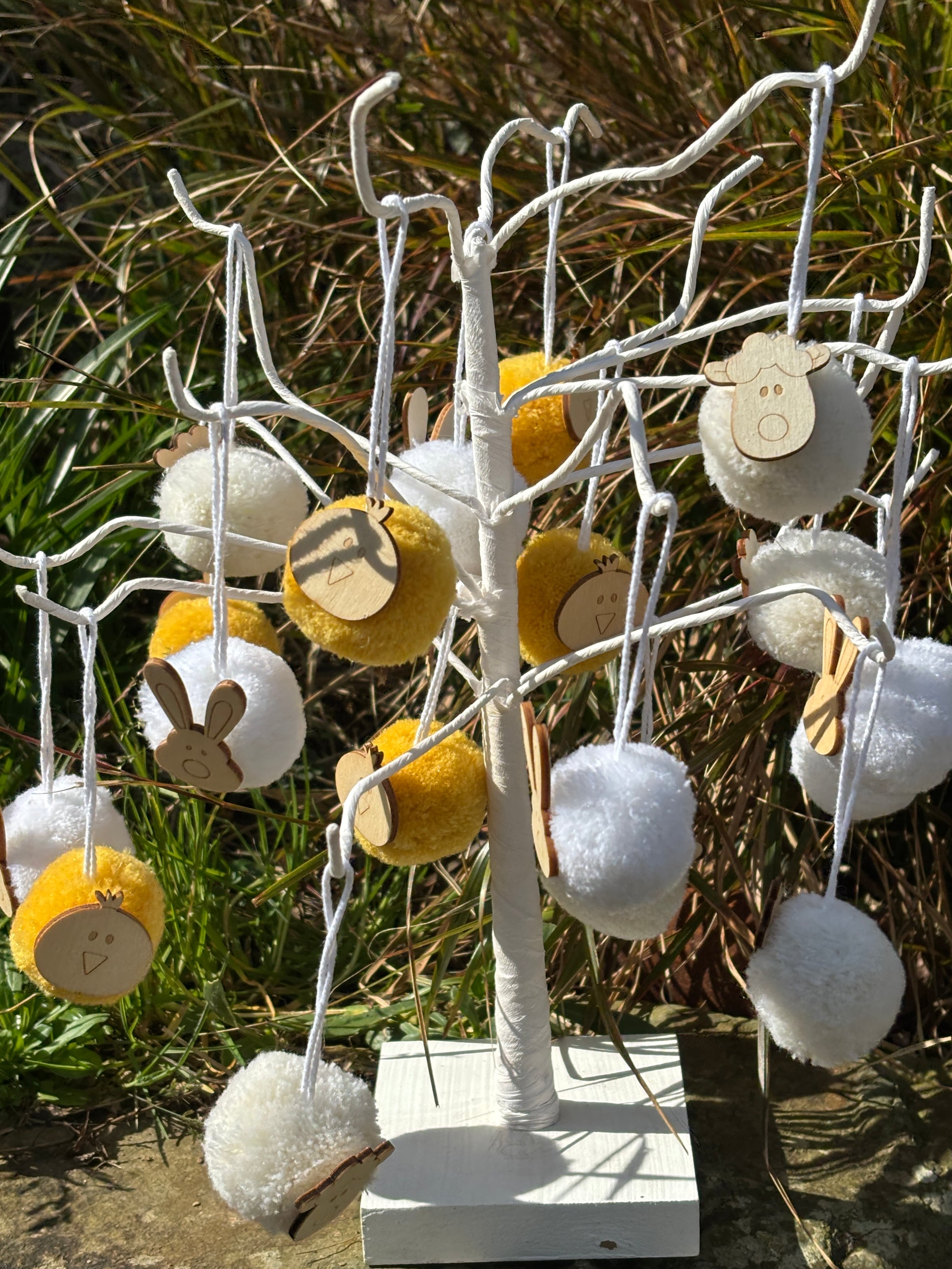 easter pom pom decorations outdoor display - white and yellow tree ornaments with wooden bunny chick lamb